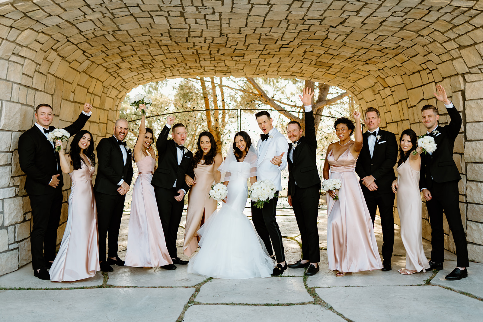 Bridal party cheers at Chateau Noland wedding in San Luis Obispo California - Cobblestone