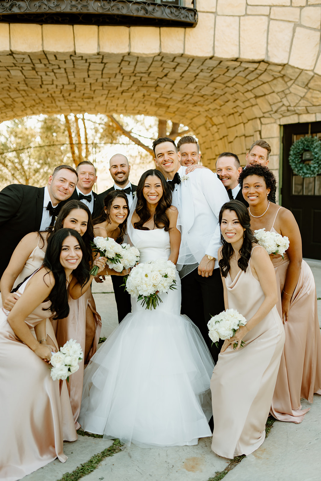 Bridal party cheer at Chateau Noland wedding in San Luis Obispo California - Cobblestone