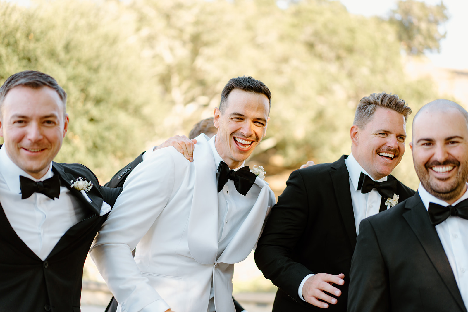 Groomsmen have fun at Chateau Noland wedding in San Luis Obispo California - Cobblestone