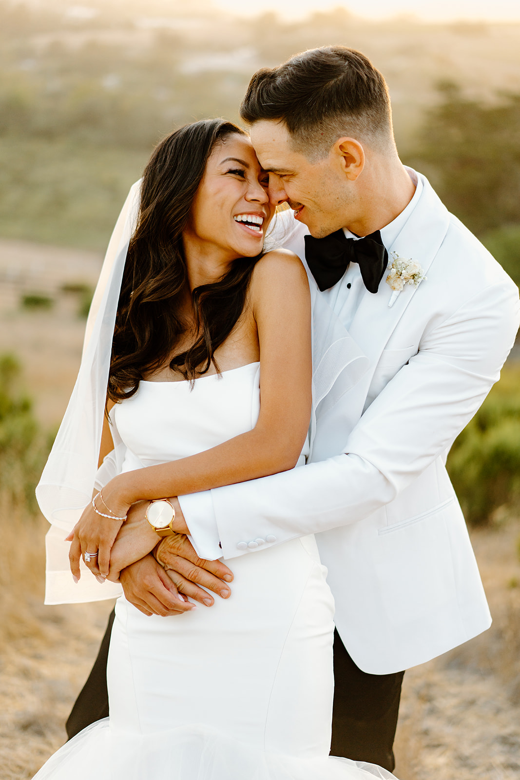 bride and groom hug at Chateau Noland, San Luis Obispo, photography by Cobblestone