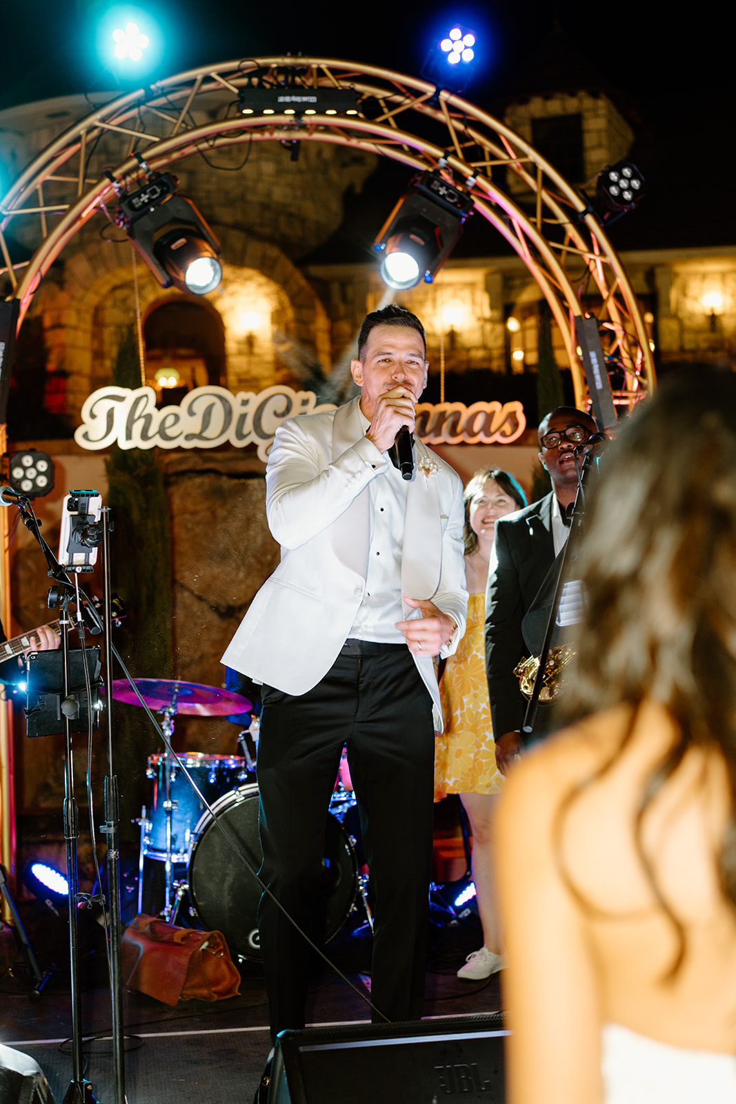 groom singing song for bride during wedding at Chateau Noland San Luis Obispo California - Cobblestone