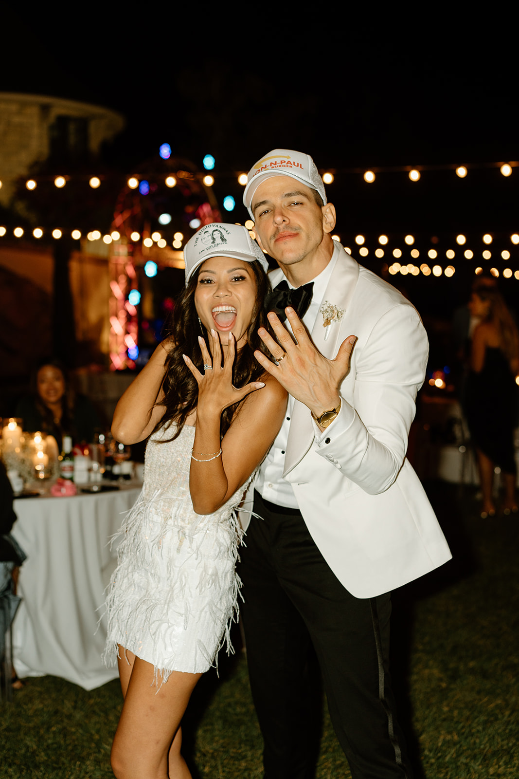 Bride and groom showing rings at wedding at Chateau Noland San Luis Obispo California