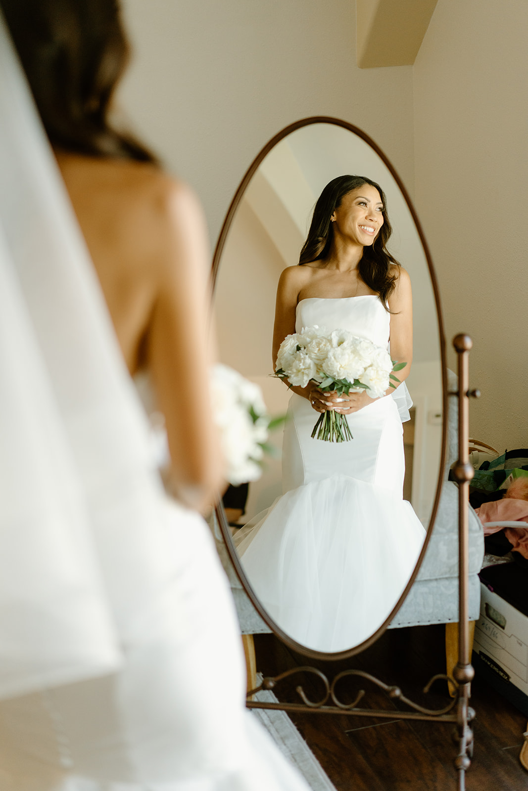 Bride looks at herself in miorror at Chateau Noland wedding in San Luis Obispo California - Cobblestone