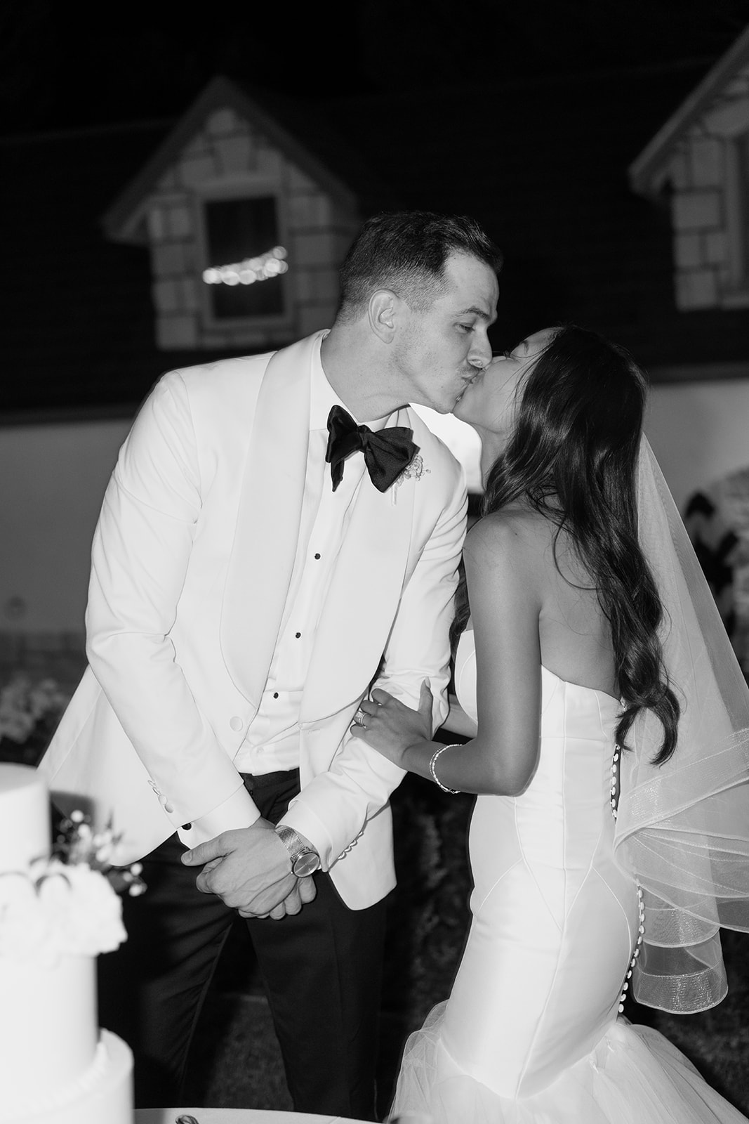 Bride and groom kiss at Chateau Noland wedding in San Luis Obispo California - Cobblestone