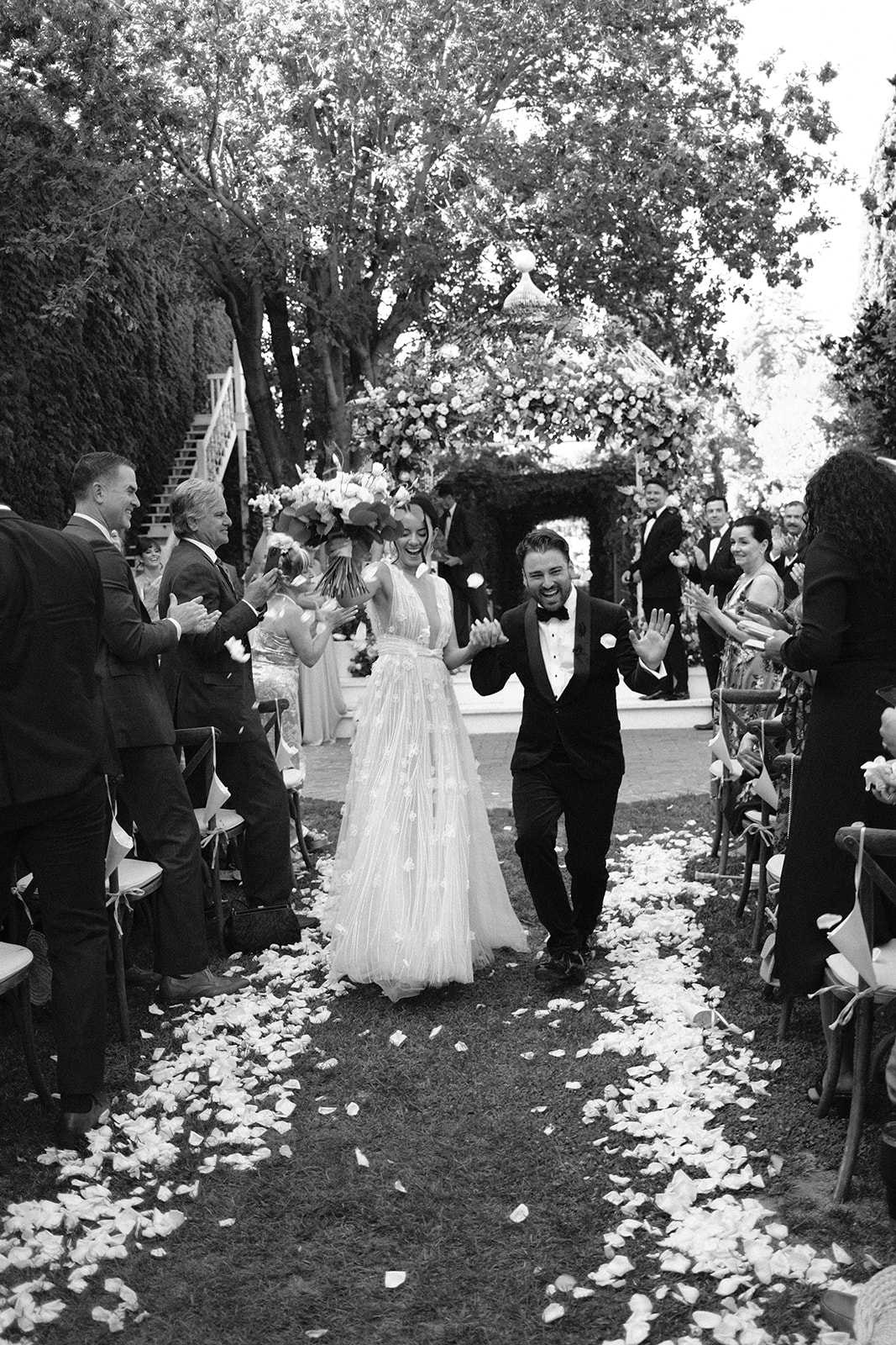 bride and groom walk down the isle at 1880 Union Hotel in Los Alamos, Ca photography by Cobblestone