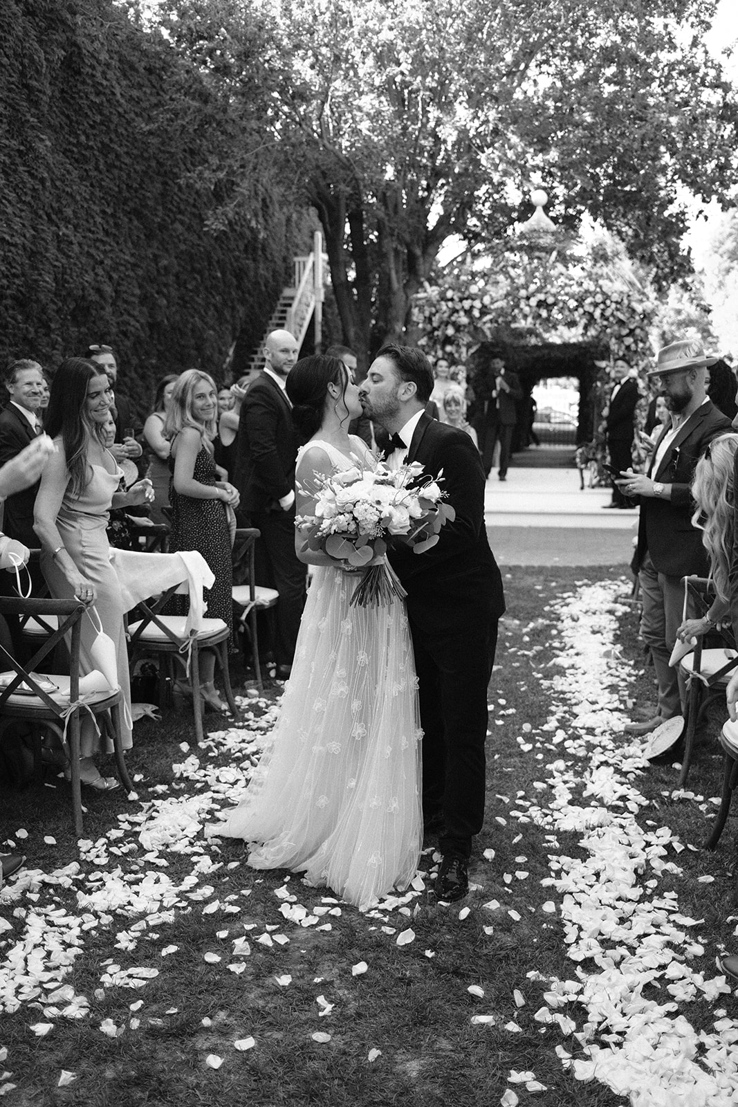 bride and groom walk down the isle at 1880 Union Hotel in Los Alamos, Ca photography by Cobblestone