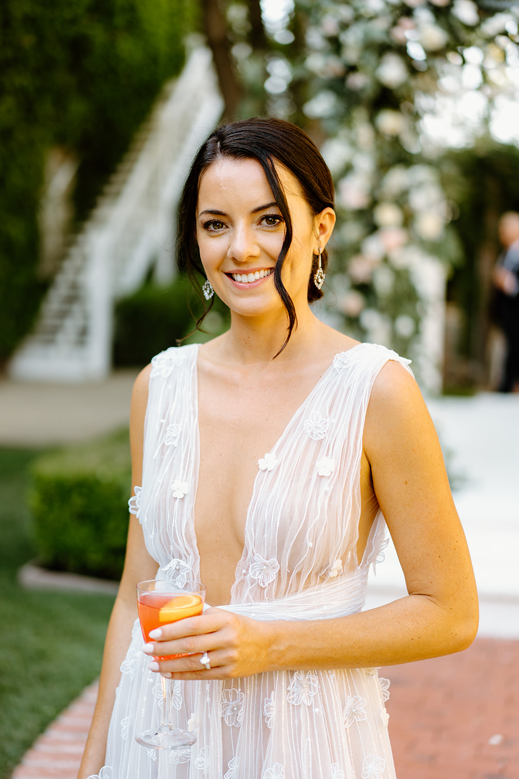 bride with drink after wedding at 1880 Union Hotel in Los Alamos, Ca photography by Cobblestone