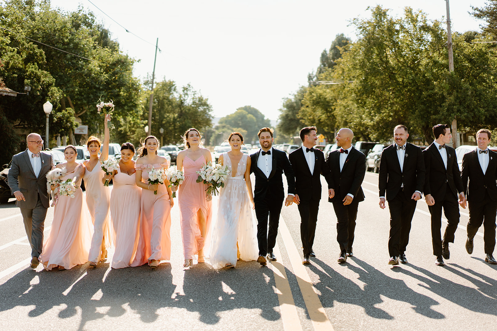 bridal party walk the street outside the 1880 Union Hotel in Los Alamos, Ca photography by Cobblestone