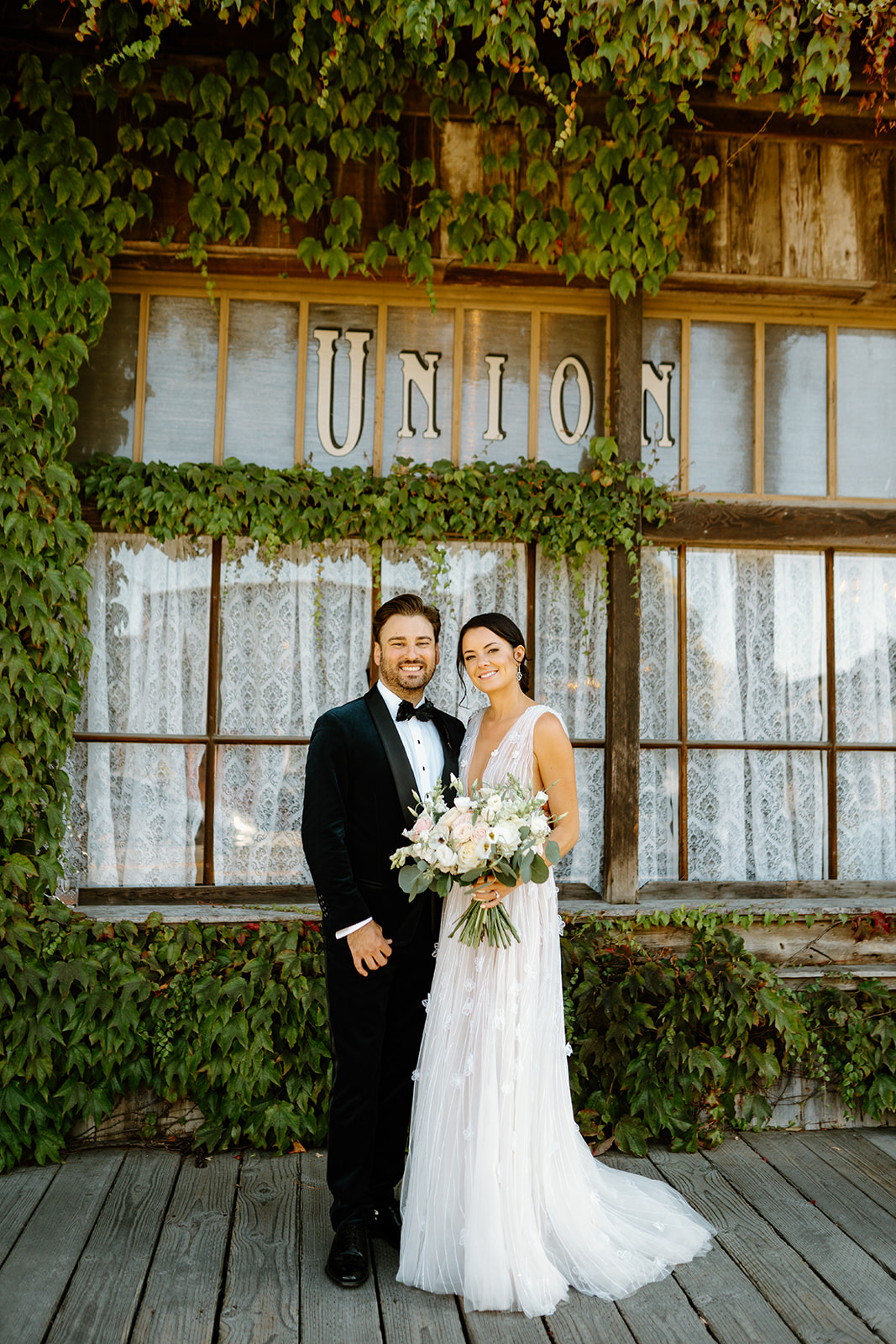 bride and groom outside 1880 Union Hotel in Los Alamos, Ca photography by Cobblestone