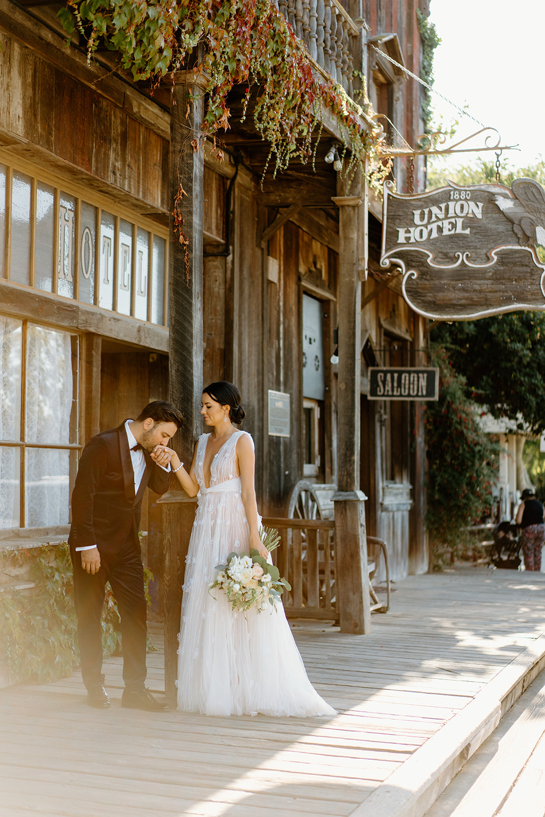 bride and groom outside 1880 Union Hotel in Los Alamos, Ca photography by Cobblestone