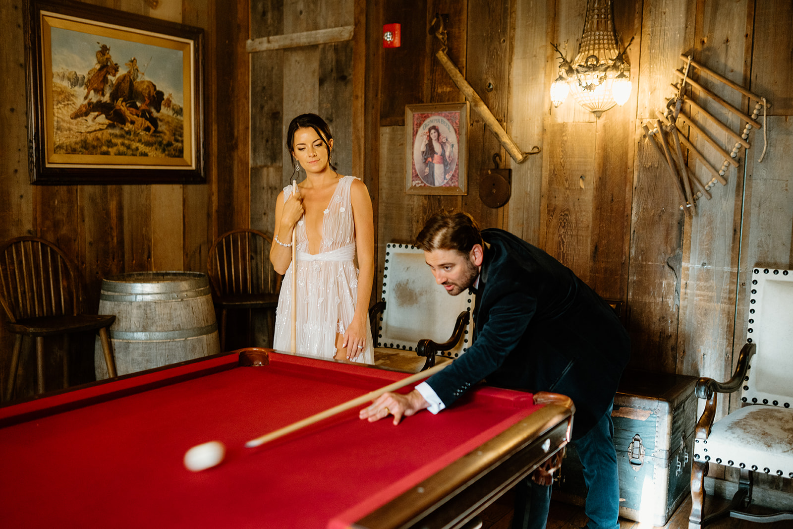 bride and groom play pool at 1880 Union Hotel in Los Alamos, Ca photography by Cobblestone