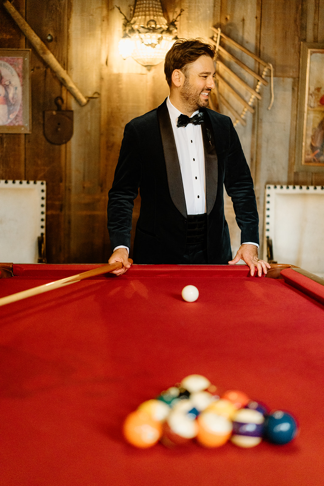 bride and groom play pool at 1880 Union Hotel in Los Alamos, Ca photography by Cobblestone