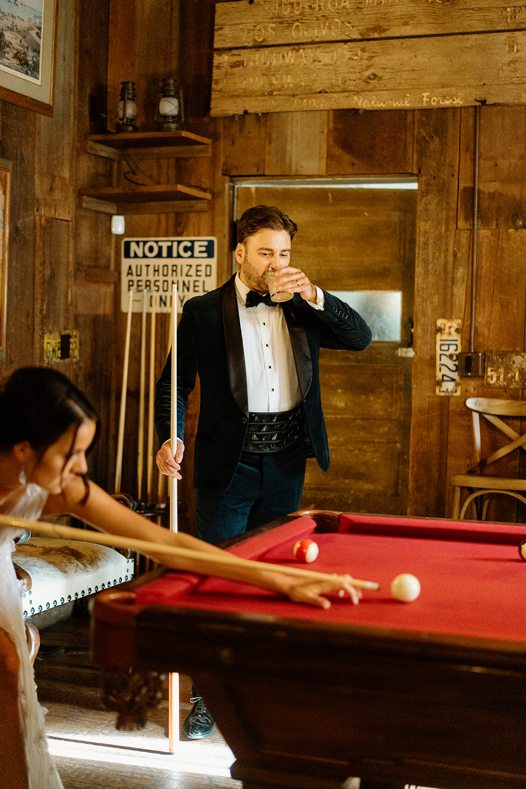bride and groom play pool at 1880 Union Hotel in Los Alamos, Ca photography by Cobblestone