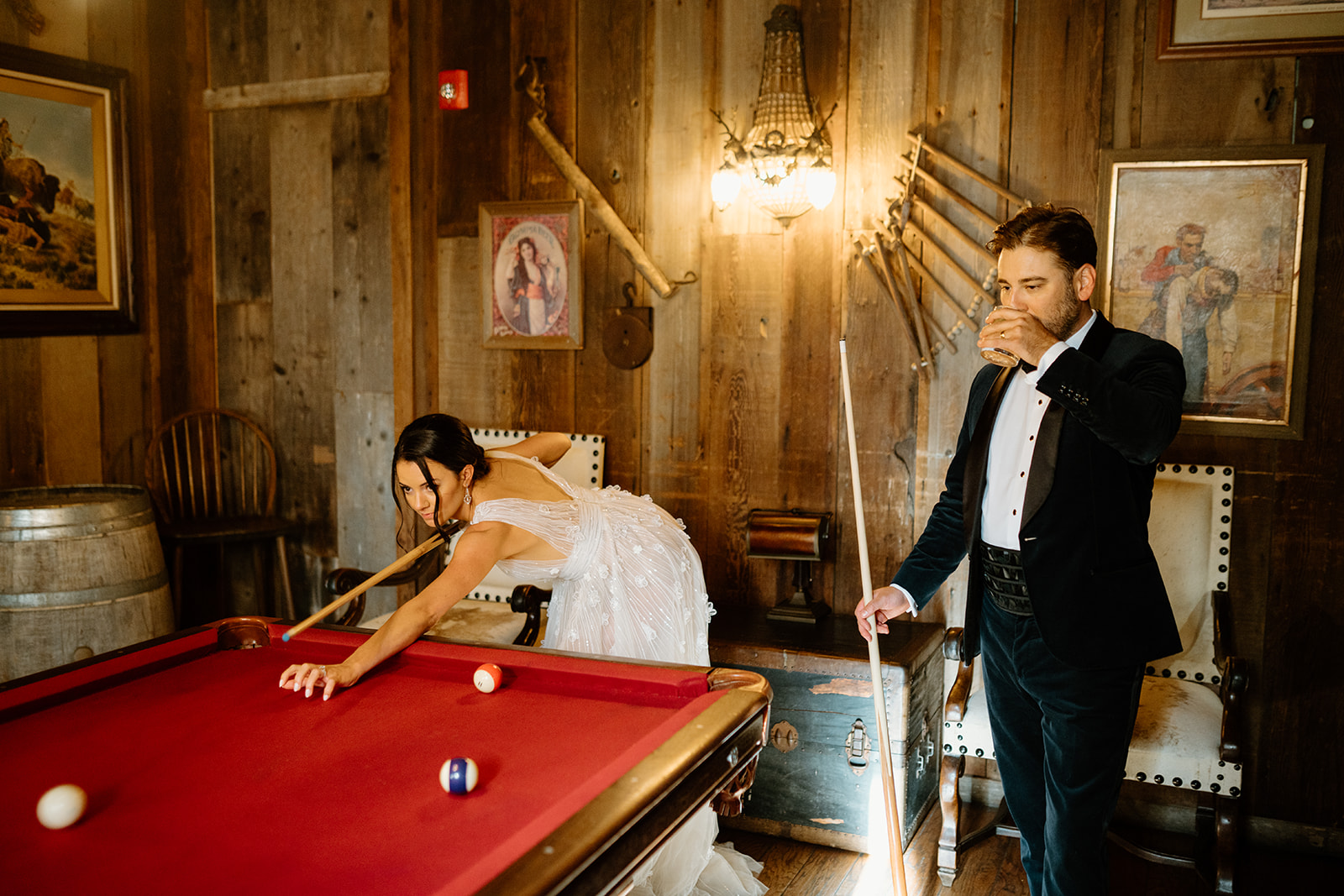 bride and groom play pool at 1880 Union Hotel in Los Alamos, Ca photography by Cobblestone