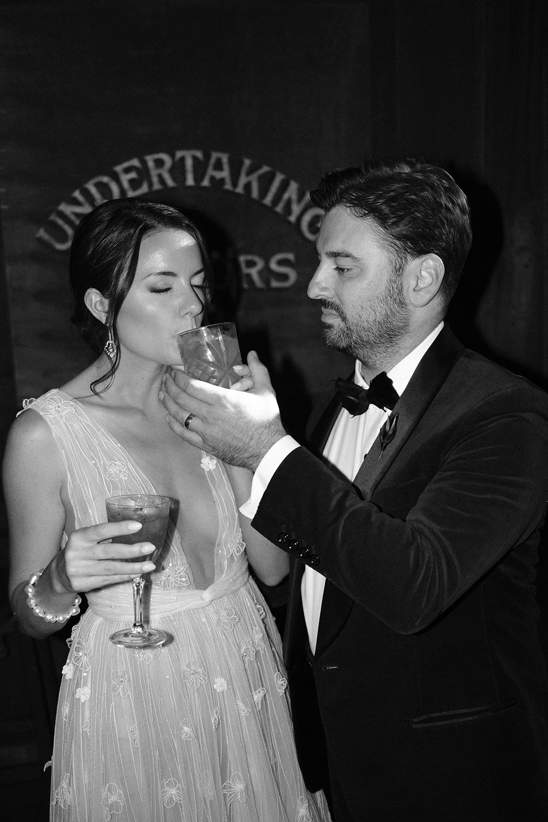 bride and groom drink cocktails at 1880 Union Hotel in Los Alamos, Ca photography by Cobblestone