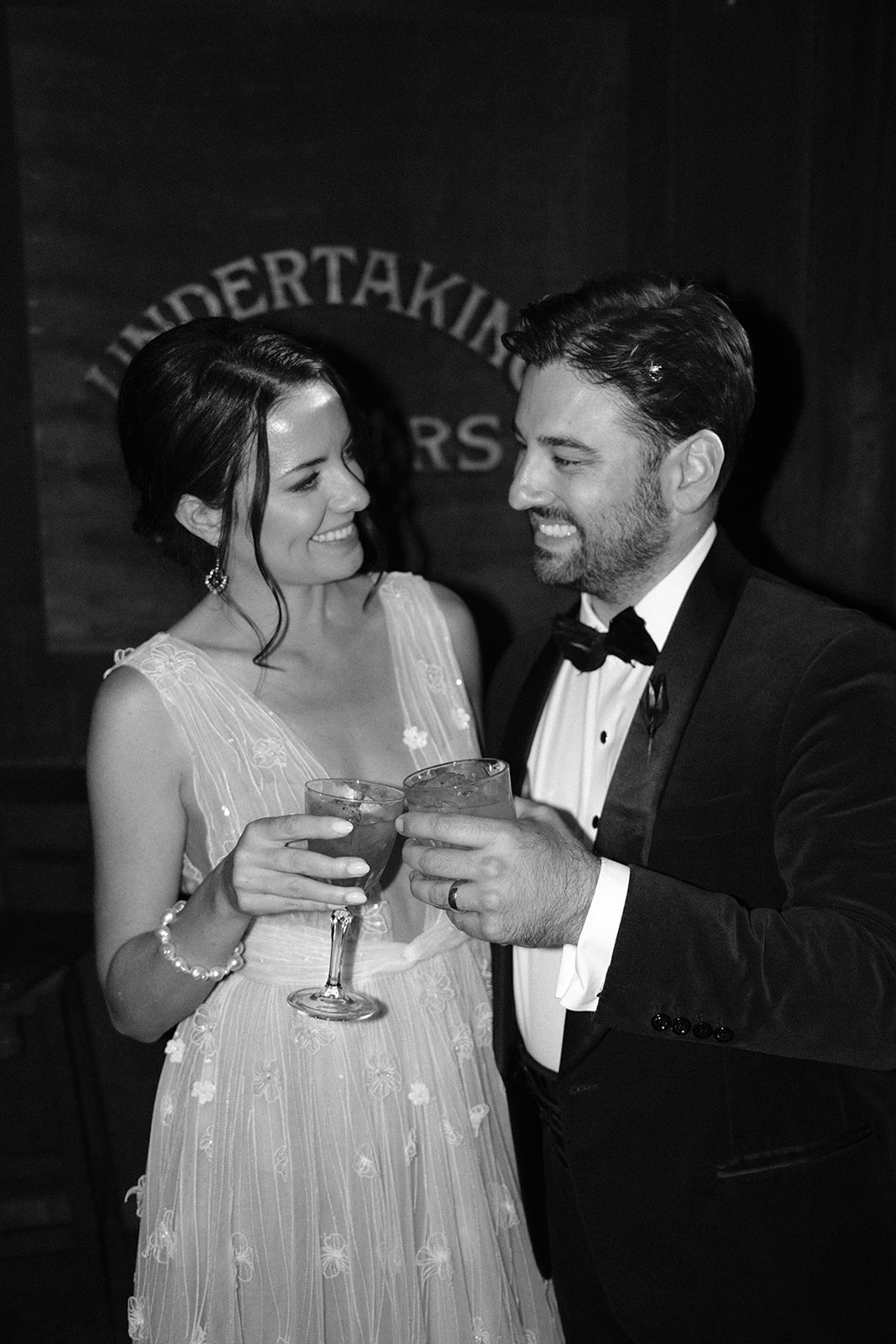 bride and groom drink cocktails at 1880 Union Hotel in Los Alamos, Ca photography by Cobblestone