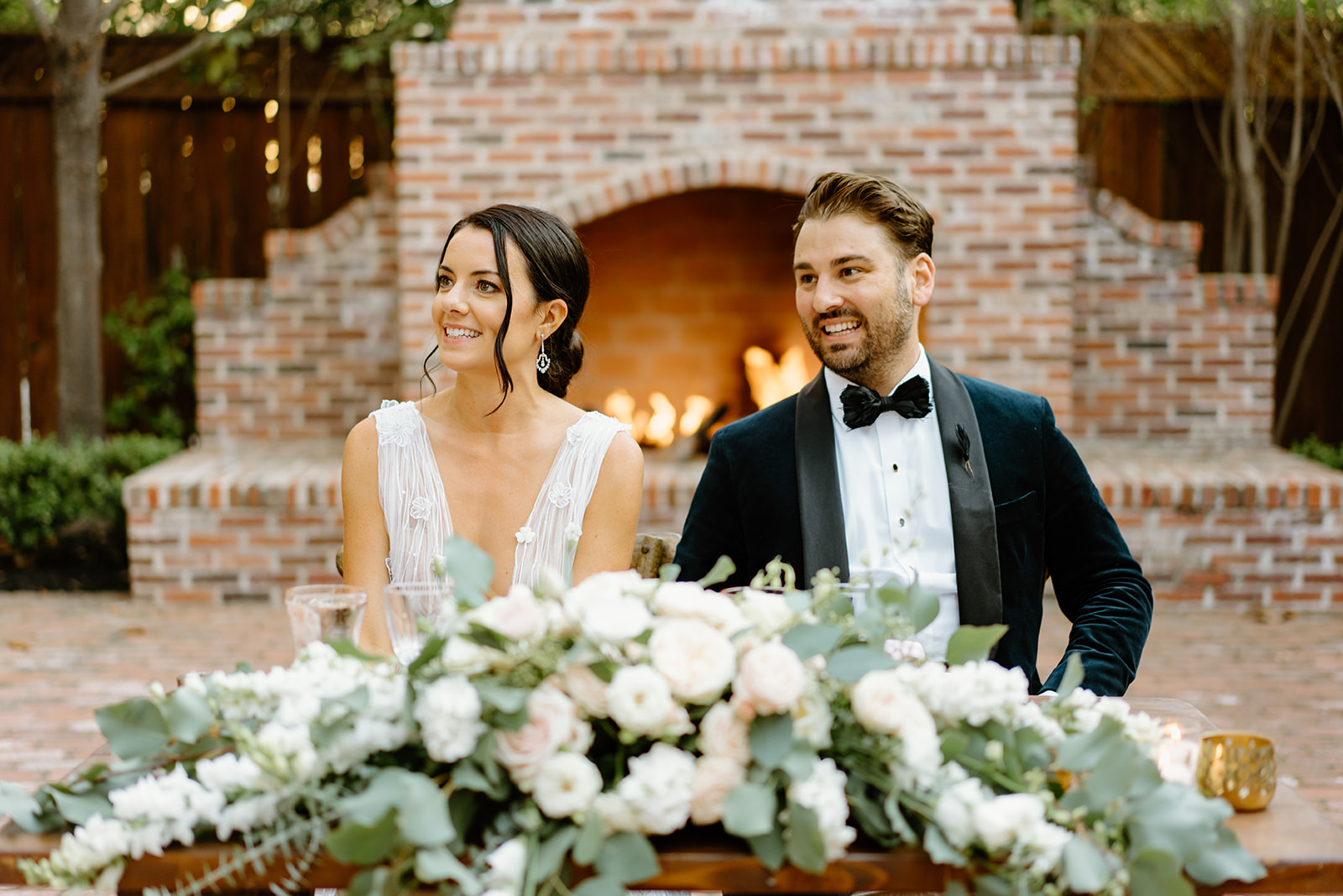 bride and groom at dinner table at 1880 Union Hotel in Los Alamos, Ca photography by Cobblestone