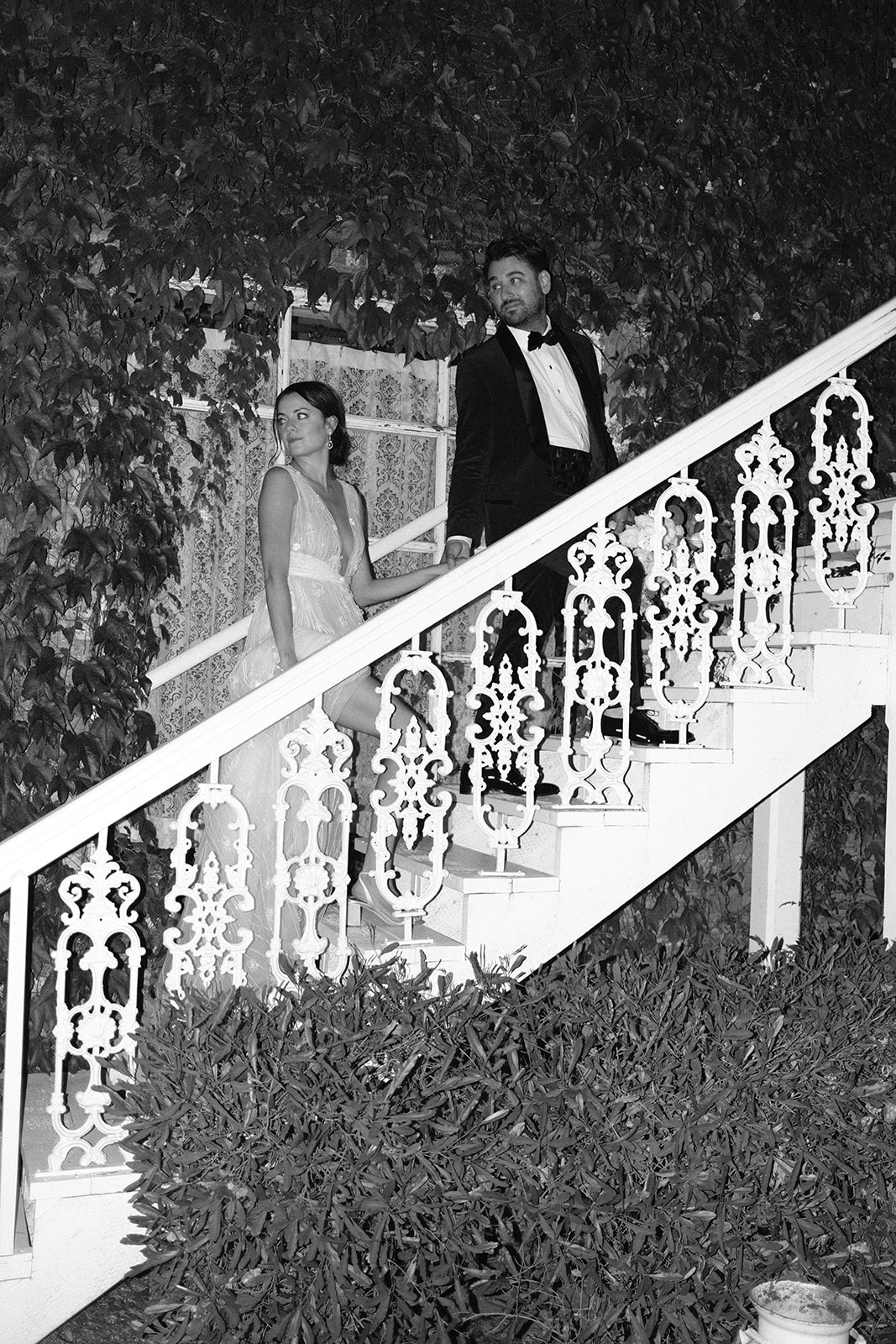 bride and groom walk up steps at 1880 Union Hotel in Los Alamos, Ca photography by Cobblestone