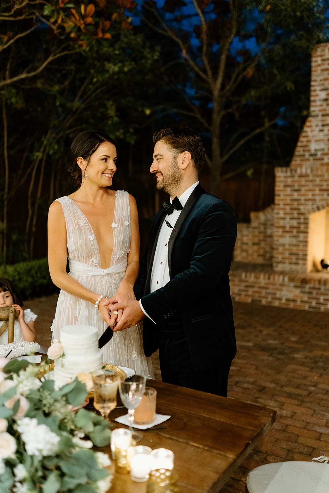 bride and groom cut cake at 1880 Union Hotel in Los Alamos, Ca photography by Cobblestone