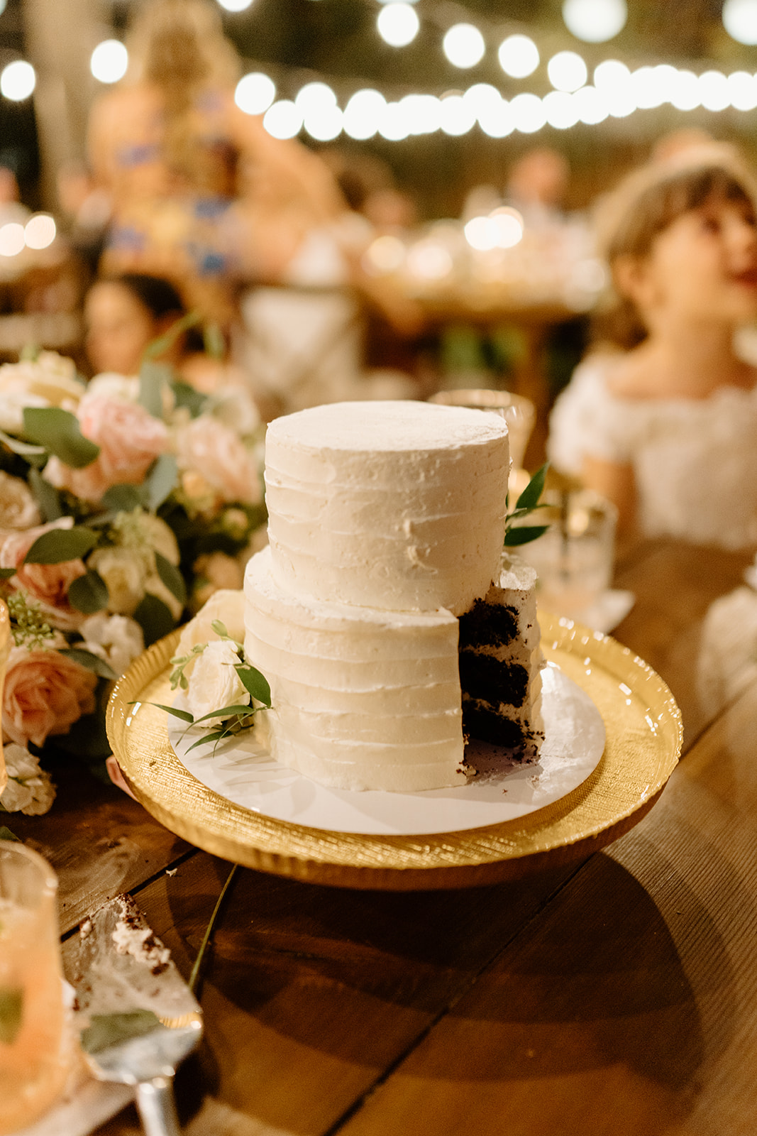 bride and groom cut cake at 1880 Union Hotel in Los Alamos, Ca photography by Cobblestone