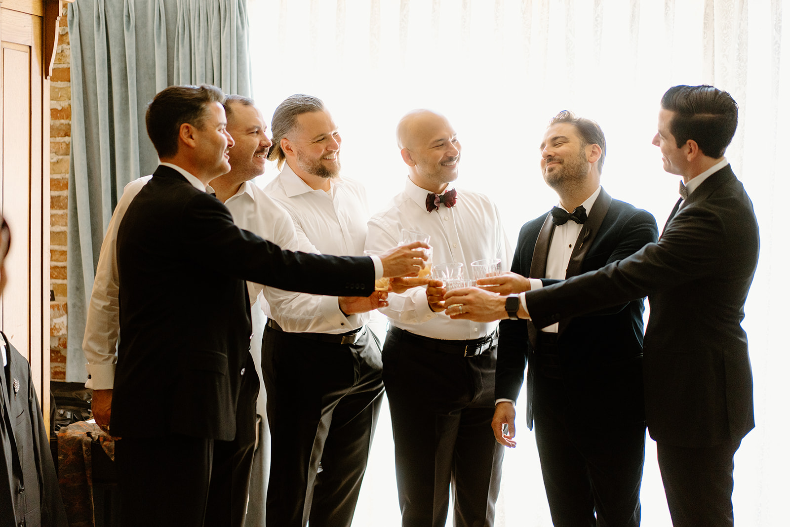 groomsmen get ready for wedding at 1880 Union Hotel in Los Alamos, Ca photography by Cobblestone