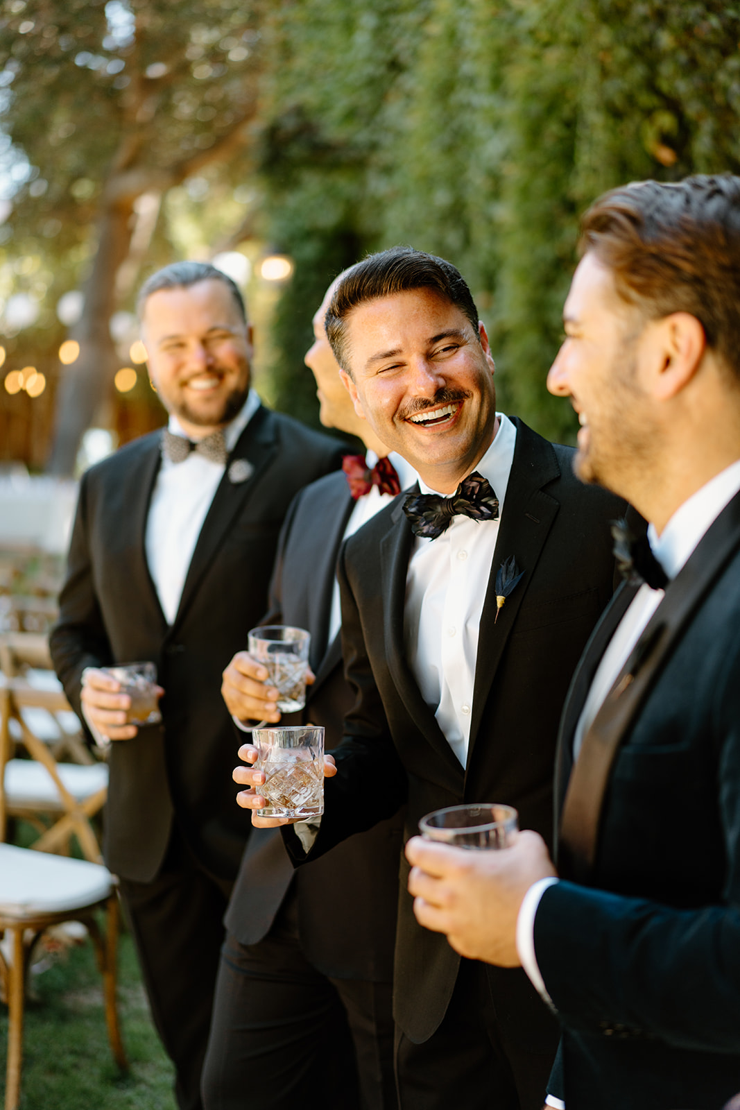 groomsmen laugh at wedding at 1880 Union Hotel in Los Alamos, Ca photography by Cobblestone