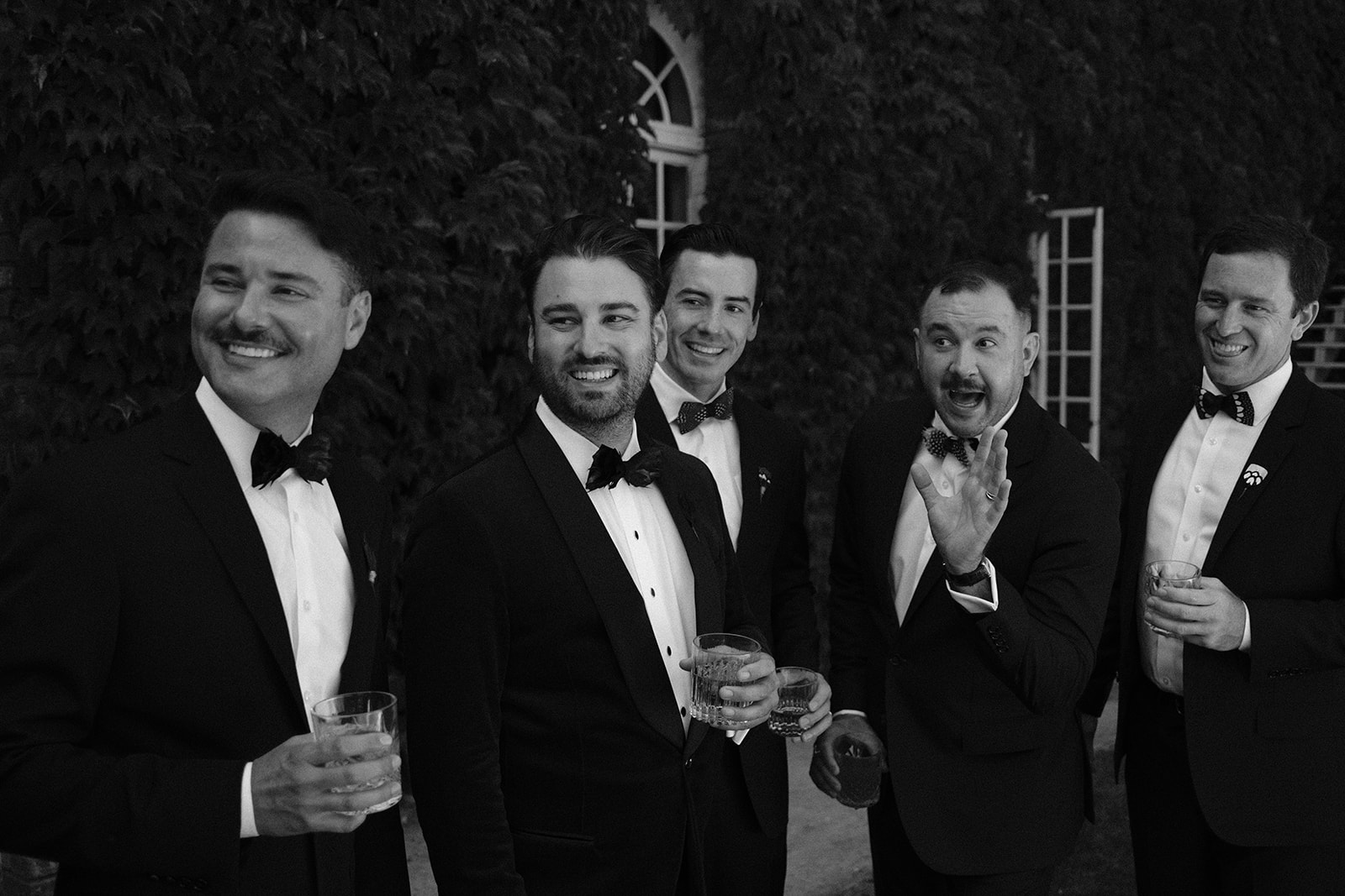 groomsmen laugh at wedding at 1880 Union Hotel in Los Alamos, Ca photography by Cobblestone