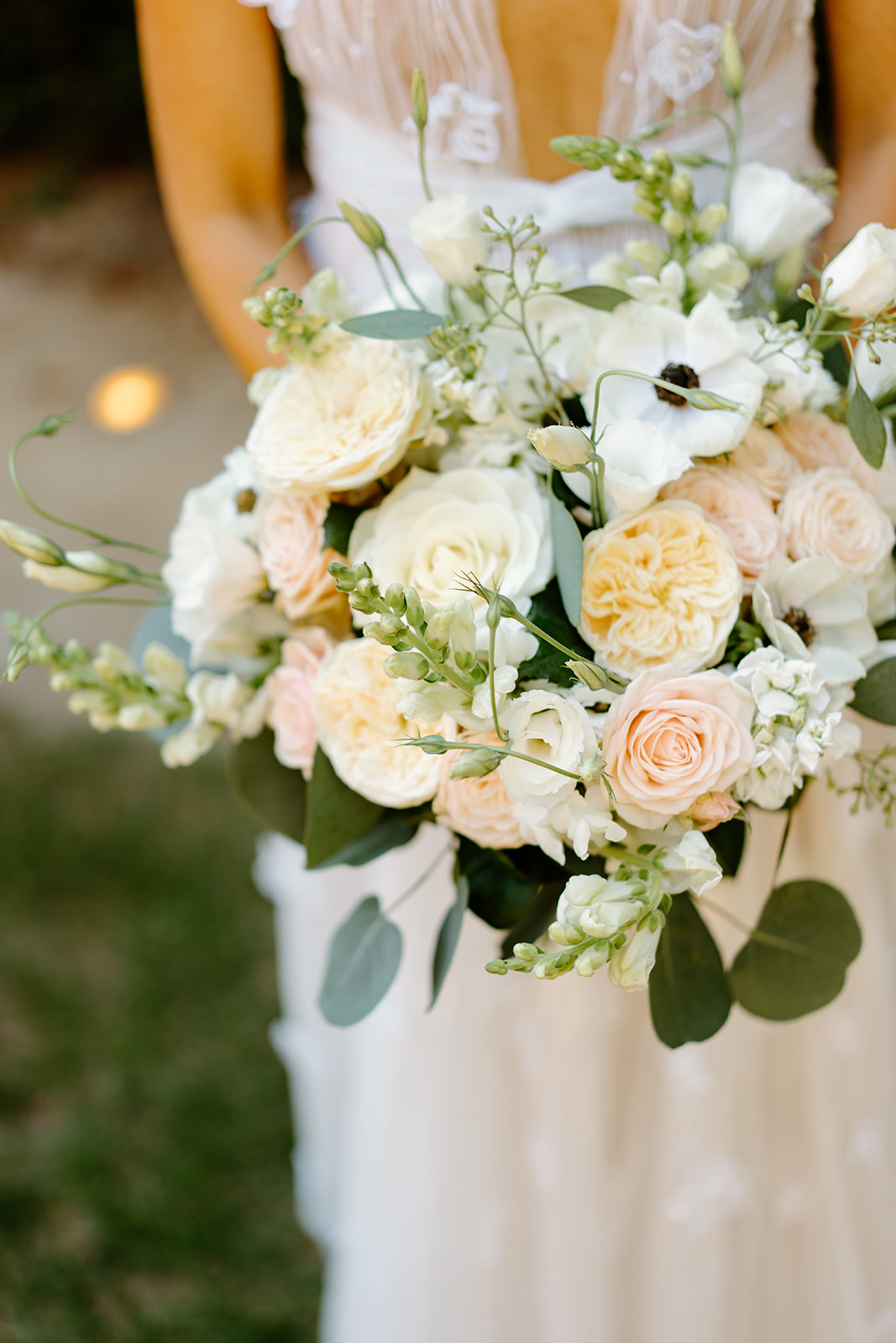 bride with florals at wedding at 1880 Union Hotel in Los Alamos, Ca photography by Cobblestone