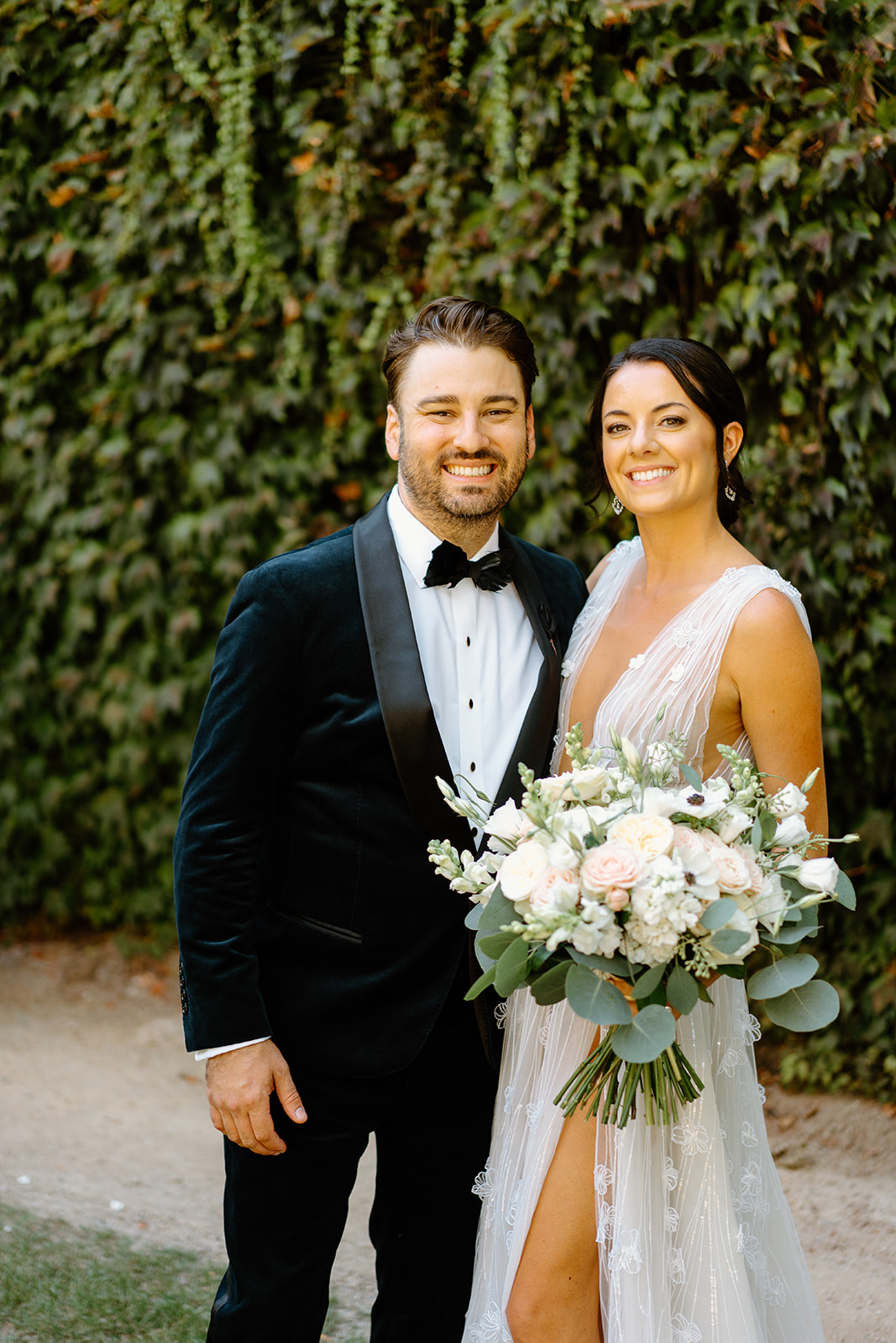 bride and groom pose after wedding at 1880 Union Hotel in Los Alamos, Ca photography by Cobblestone
