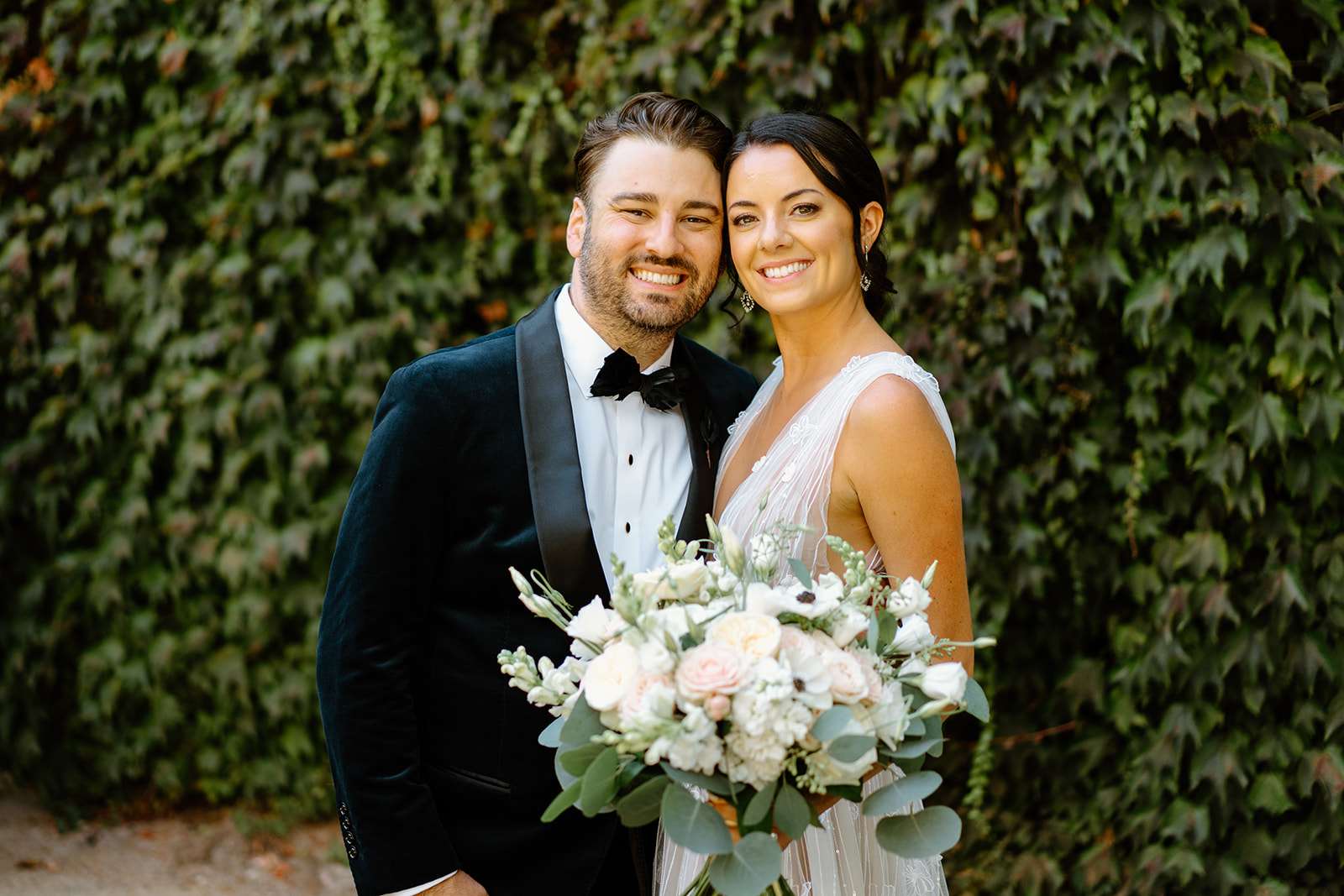bride and groom pose after wedding at 1880 Union Hotel in Los Alamos, Ca photography by Cobblestone