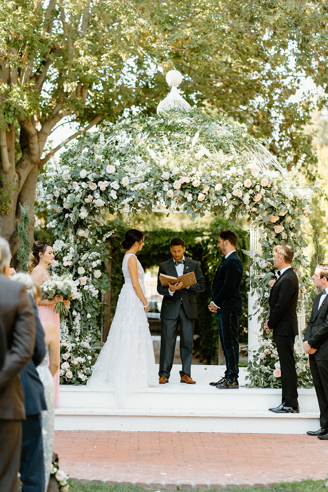 bride and groom at ceremony at 1880 Union Hotel in Los Alamos, Ca photography by Cobblestone