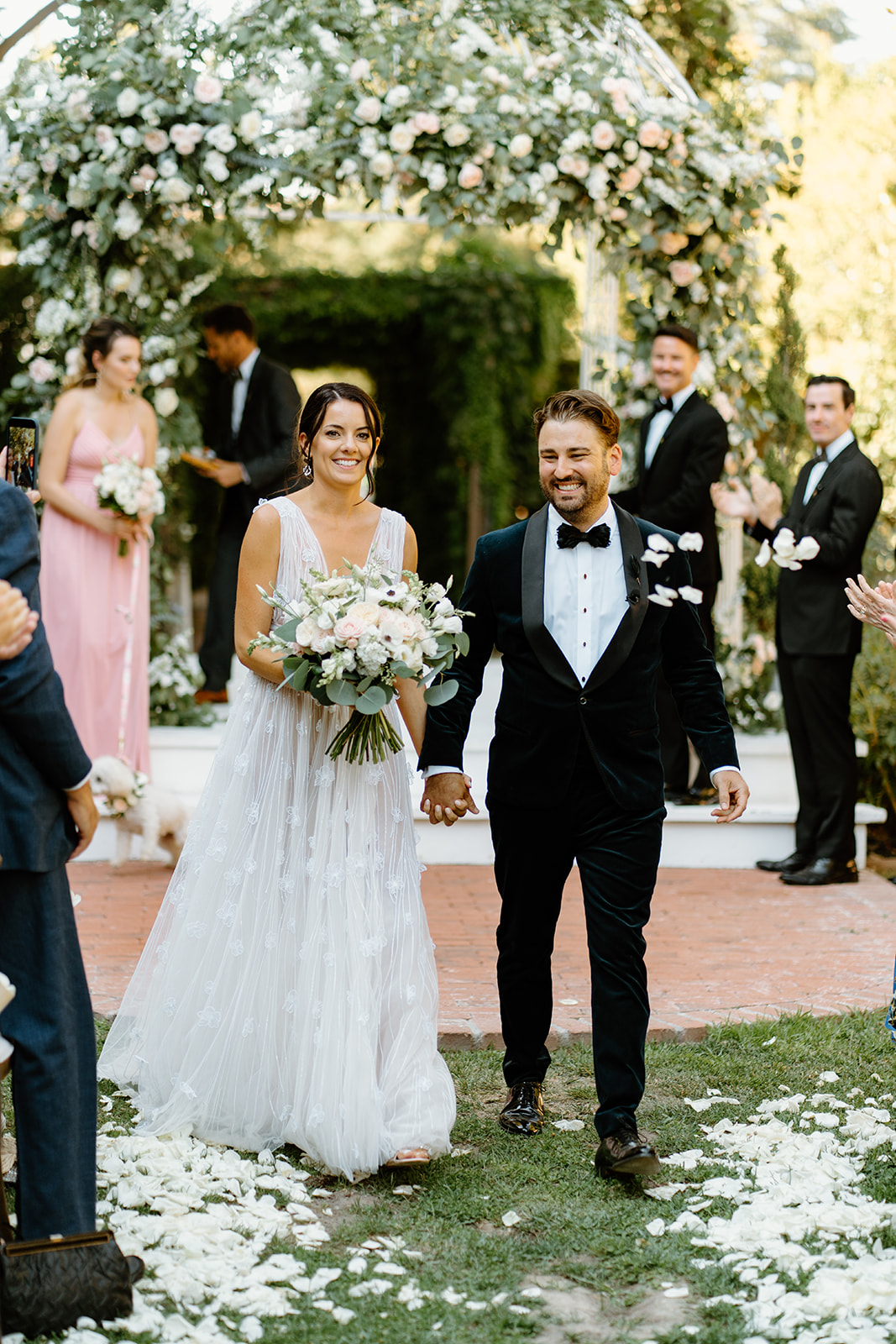 bride and groom walk down the isle at 1880 Union Hotel in Los Alamos, Ca photography by Cobblestone