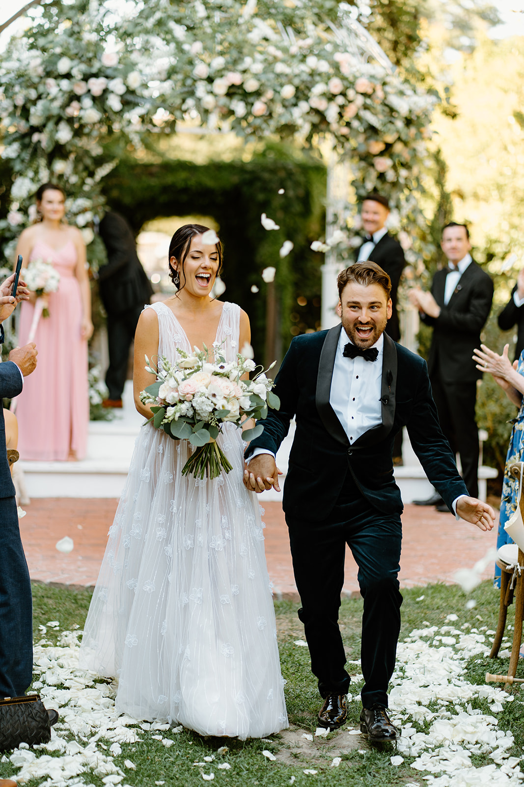bride and groom walk down the isle at 1880 Union Hotel in Los Alamos, Ca photography by Cobblestone