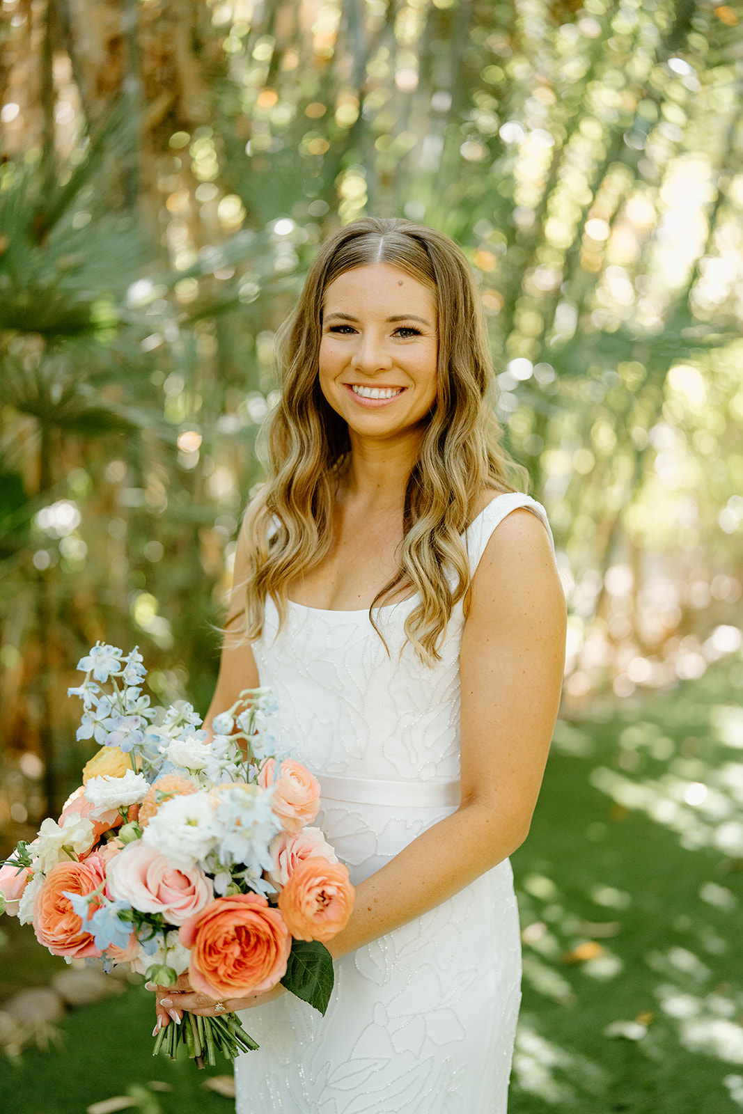 Bride with bouquet at wedding at Botanica in Oceanside California, photography by Cobblestone Weddings
