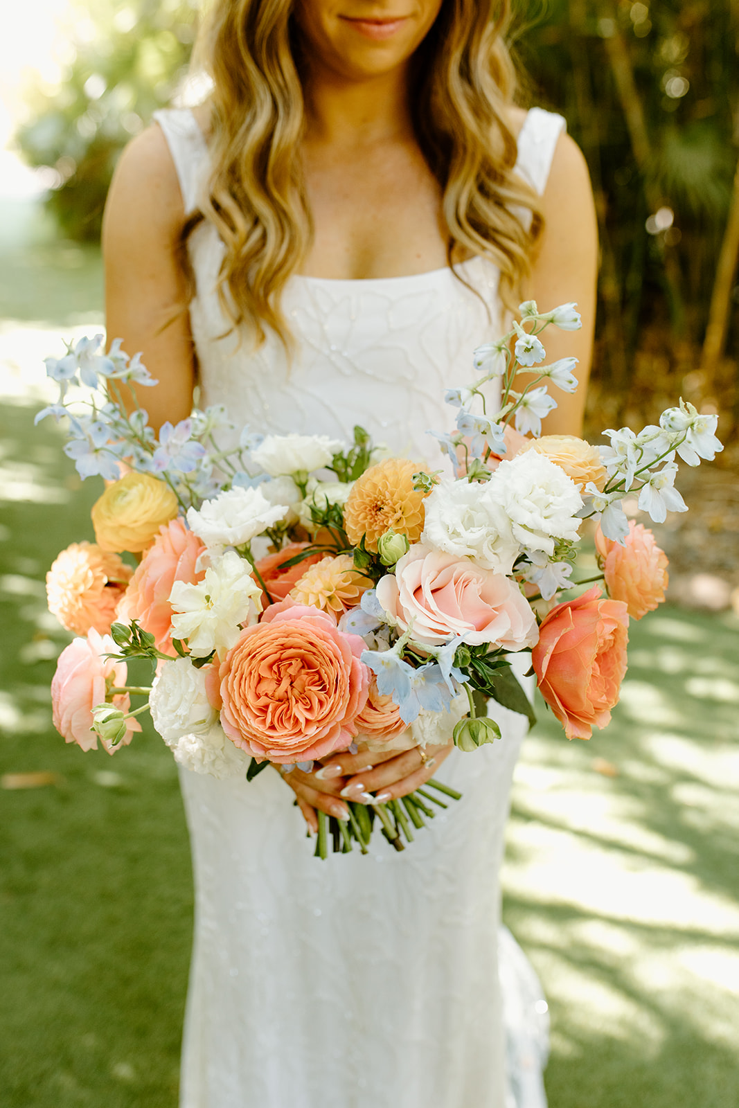 Bride with bouquet at wedding at Botanica in Oceanside California, photography by Cobblestone Weddings
