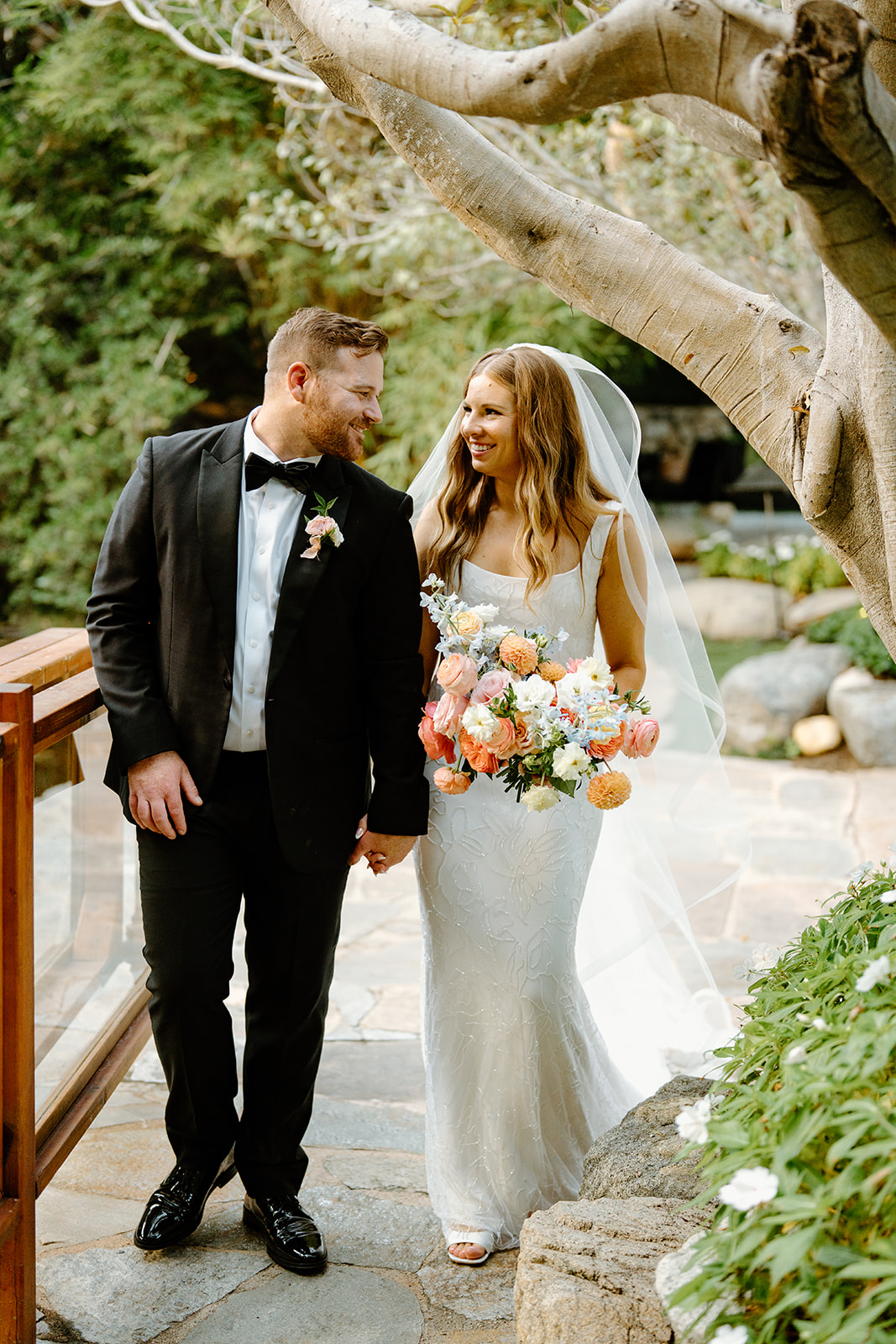 bride and groom walking after wedding at Oceanside California, photography by Cobblestone Weddings