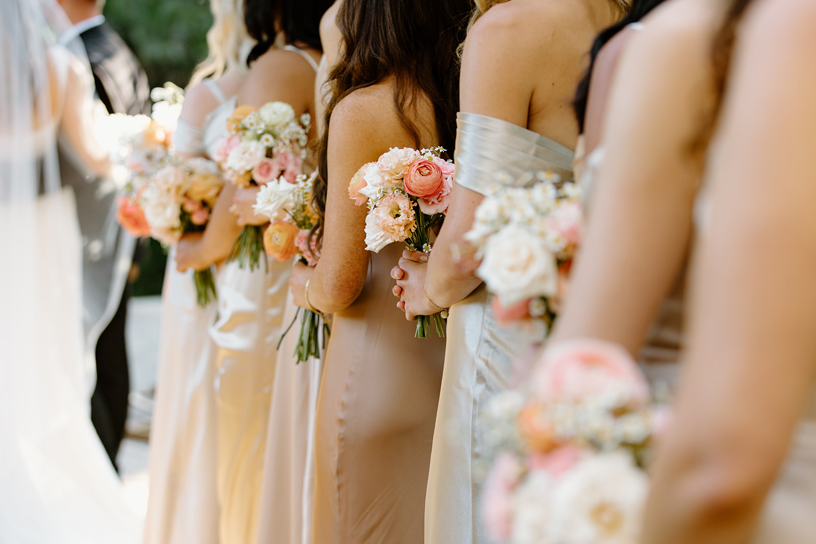 bridesmaids florals at wedding at Oceanside California, photography by Cobblestone Weddings