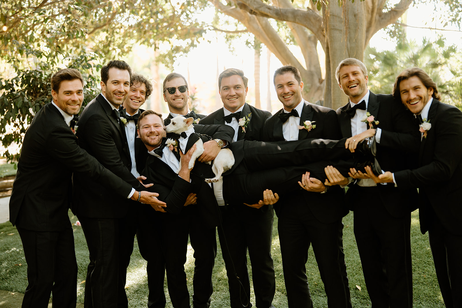 groomsmen hold groom at wedding at Botanica, Oceanside California, photography by Cobblestone