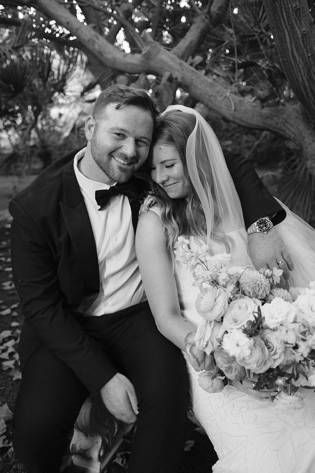 bride and groom cuddle up after wedding in San Luis Obispo CA, photography by Cobblestone