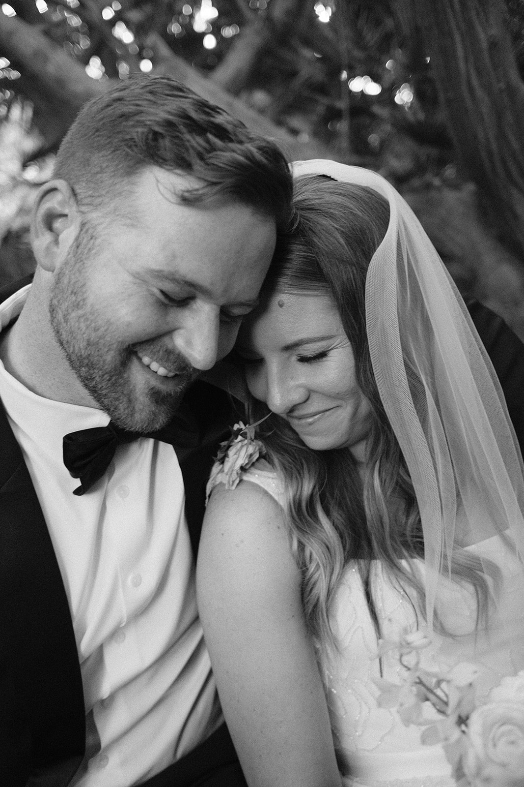 bride and groom cuddle up after wedding in San Luis Obispo CA, photography by Cobblestone