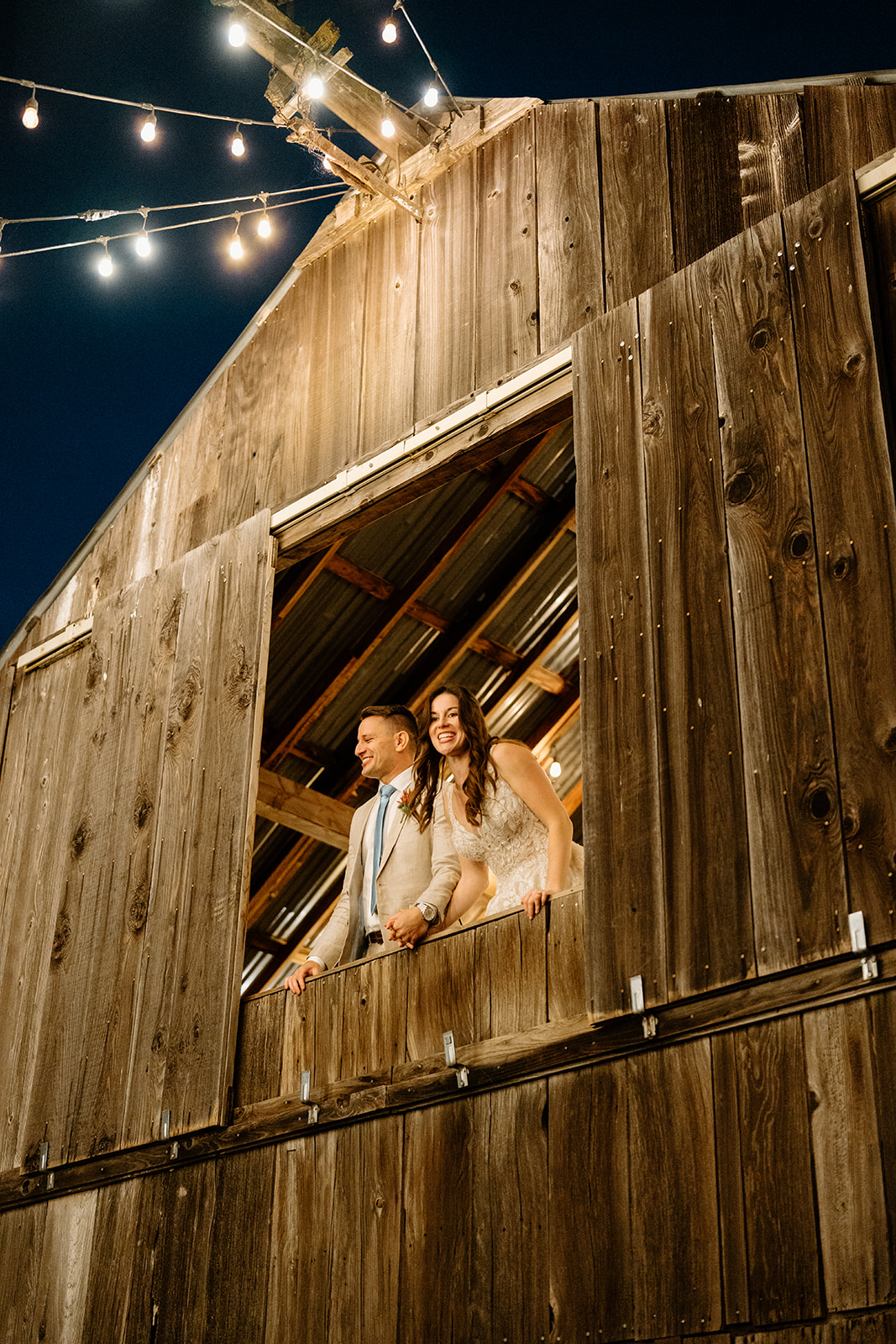 bride and groom in a barn at Higuera Ranch, San Luis Obispo CA, photography by Cobblestone