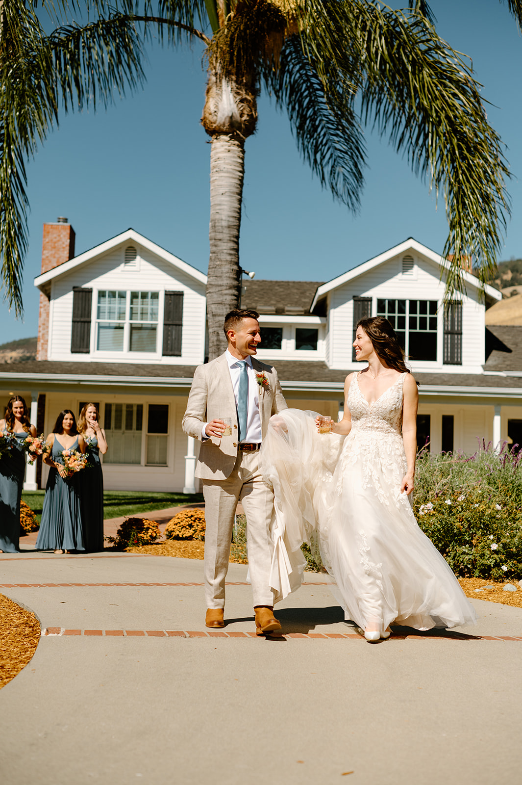 bride and groom walk together at Higuera Ranch, San Luis Obispo CA, photography by Cobblestone