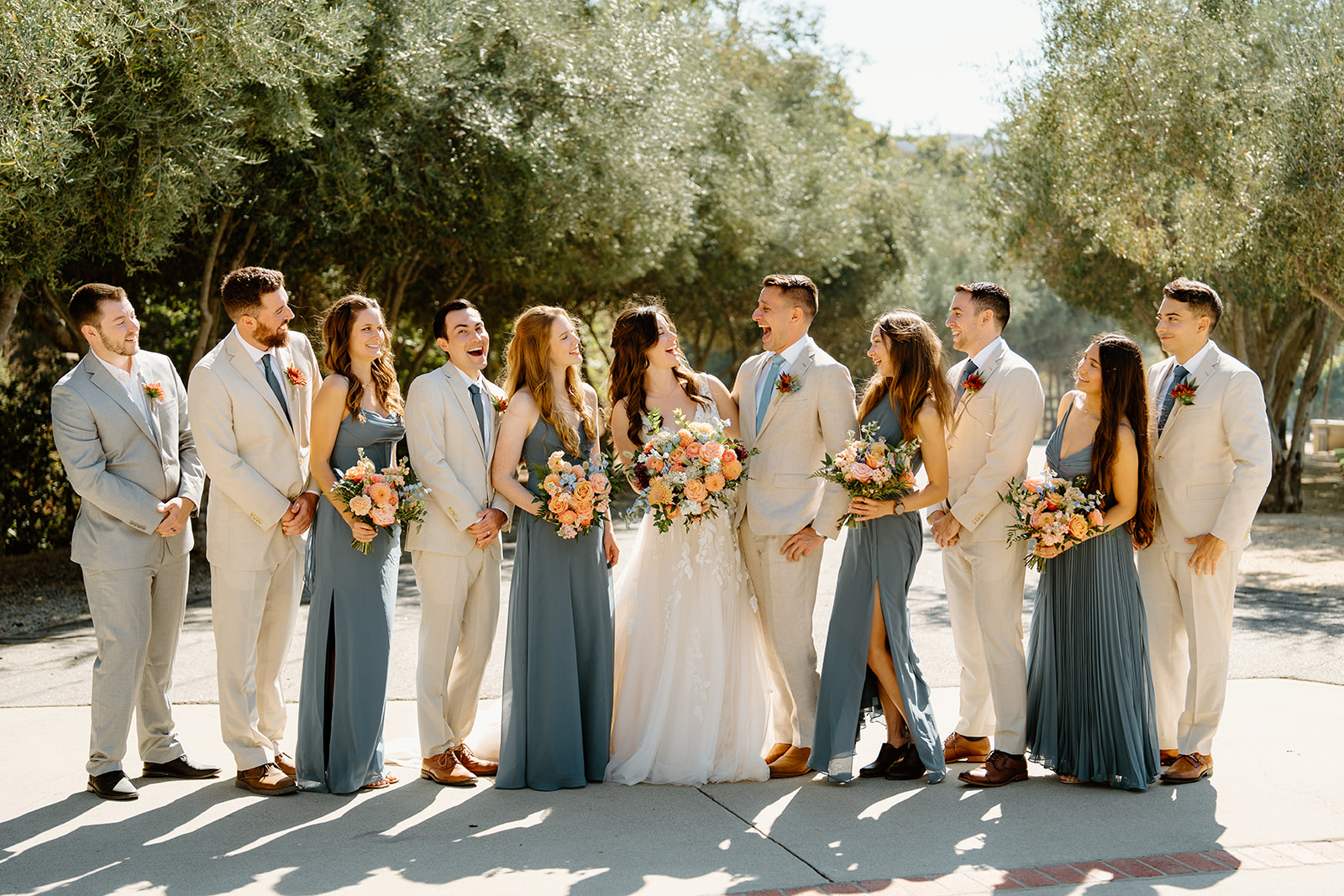 Bridal party looks at each other at Higuera Ranch, San Luis Obispo CA, photography by Cobblestone