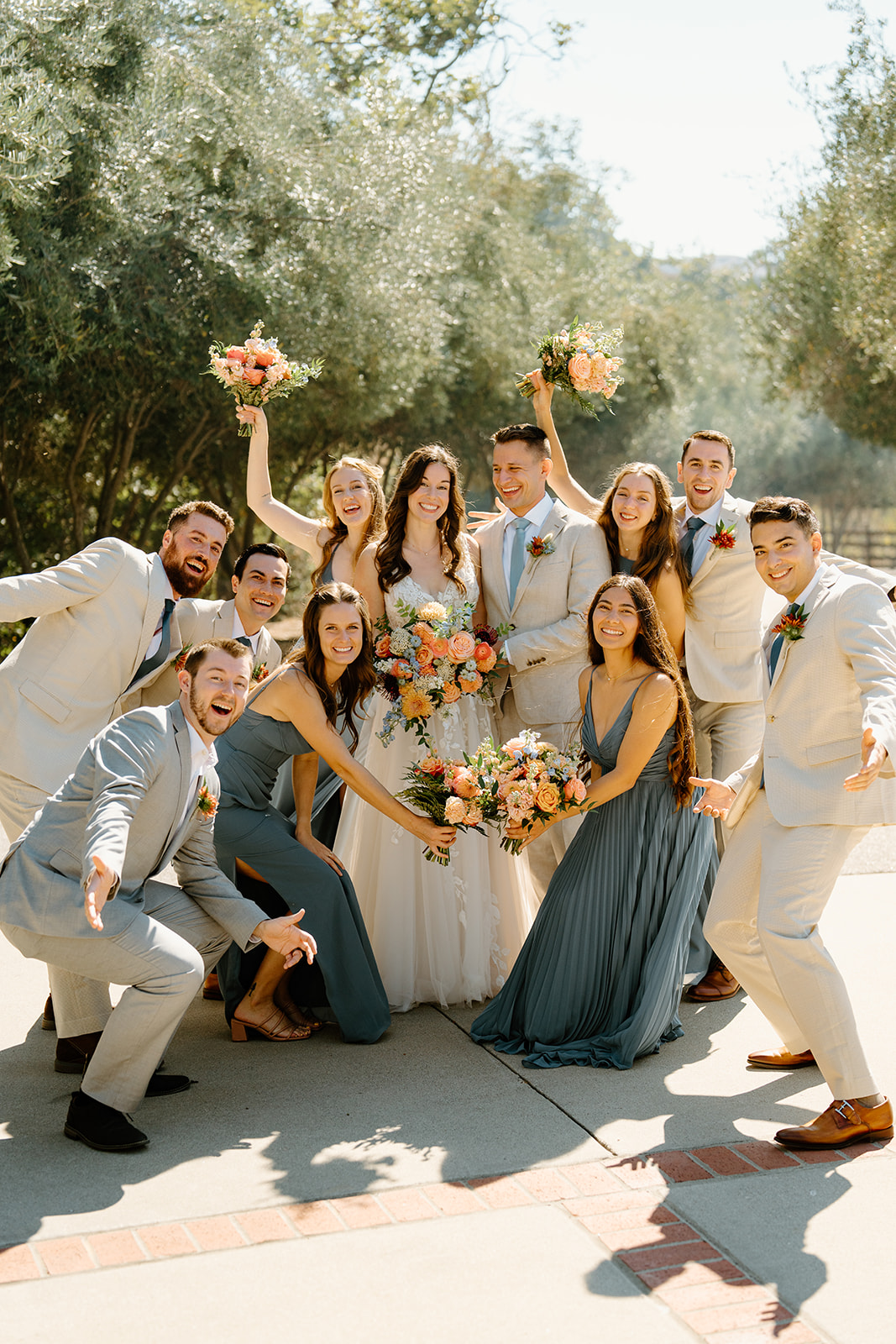 Bridal party cheers at Higuera Ranch, San Luis Obispo CA, photography by Cobblestone