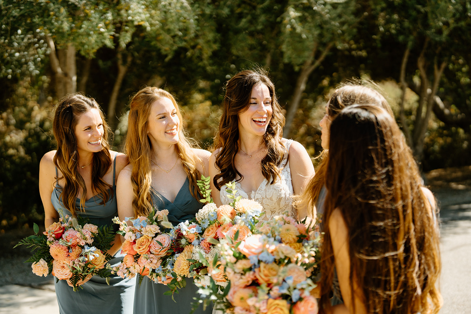 Bridal party looks at each other at Higuera Ranch, San Luis Obispo CA, photography by Cobblestone