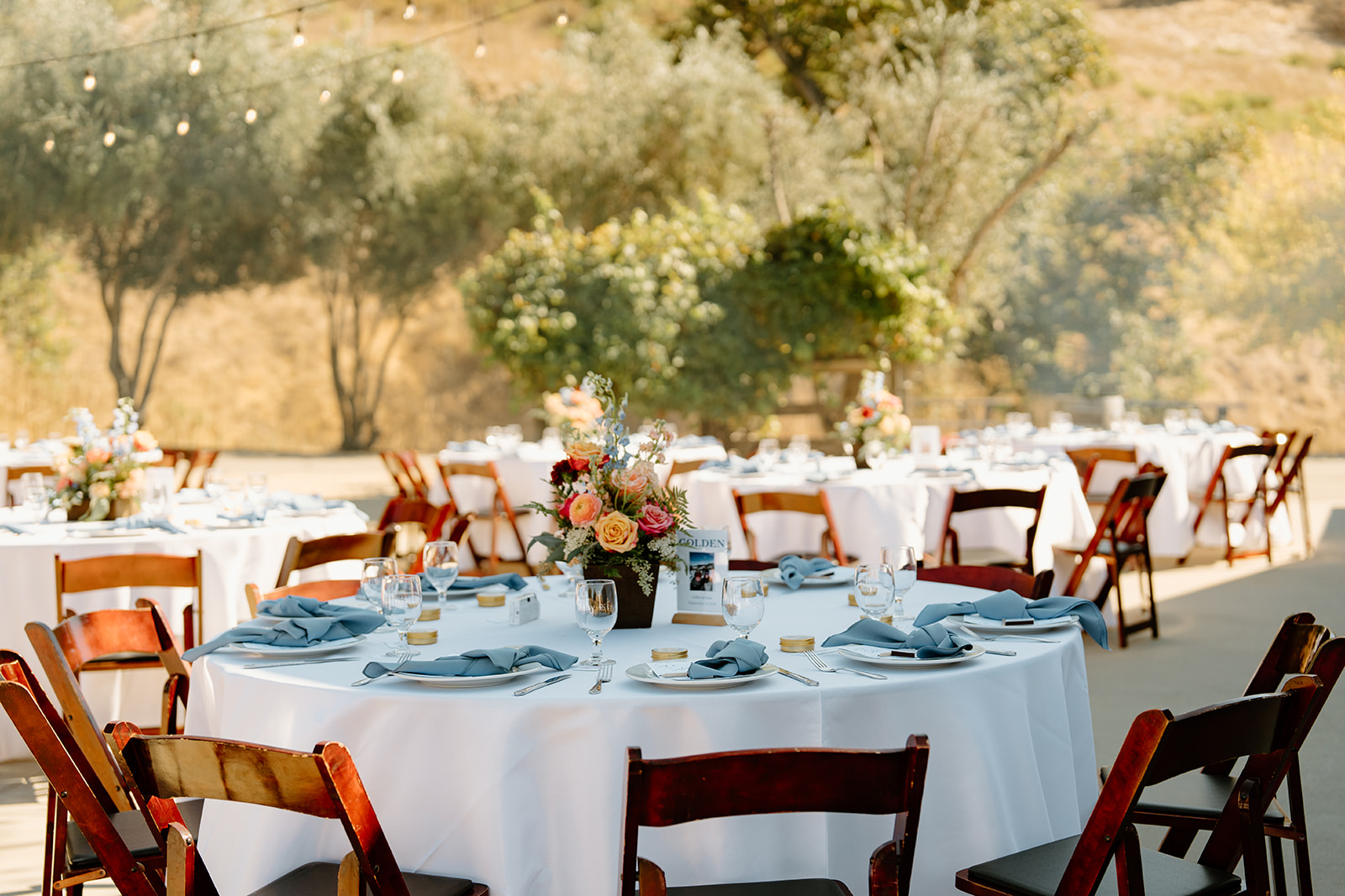 Table details with florals and plates at Higuera Ranch, San Luis Obispo CA, photography by Cobblestone