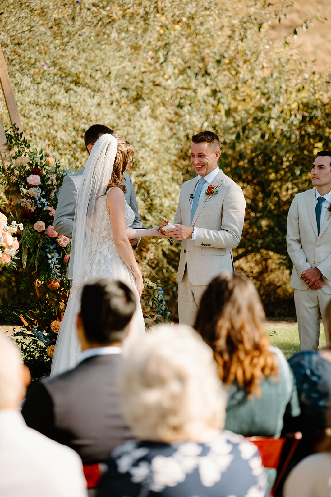Groom Reads vows during ceremony at Higuera Ranch, San Luis Obispo CA, photography by Cobblestone