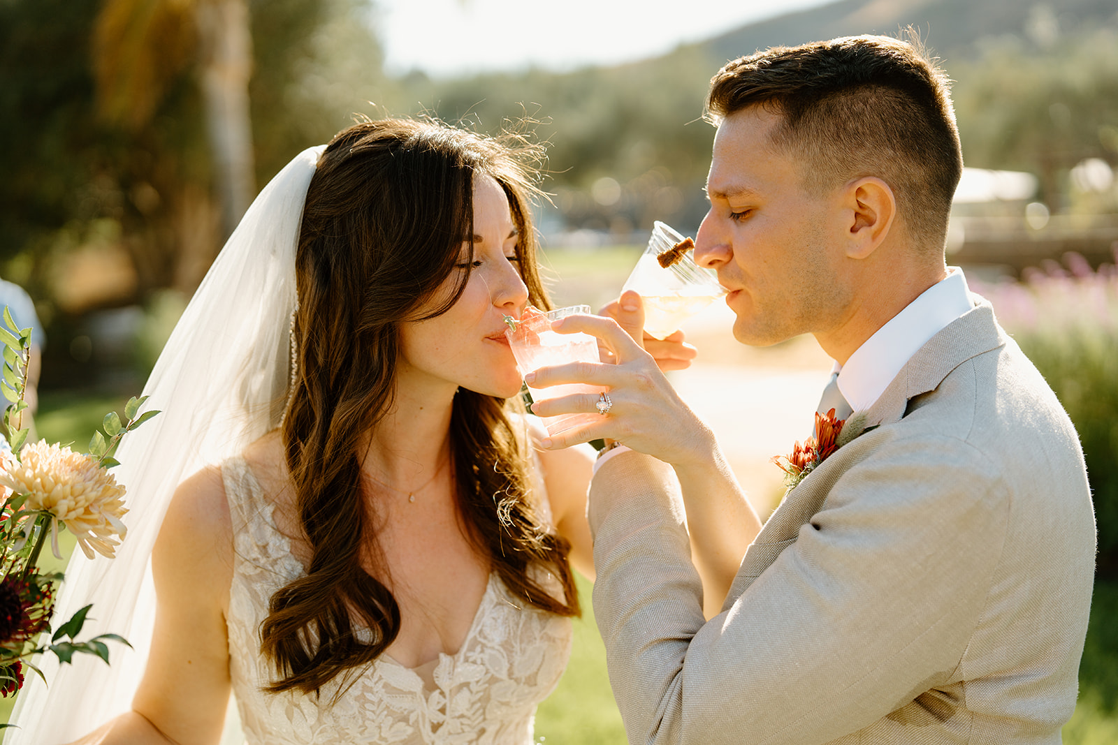 bride and groom drink cocktails at Higuera Ranch, San Luis Obispo CA, photography by Cobblestone