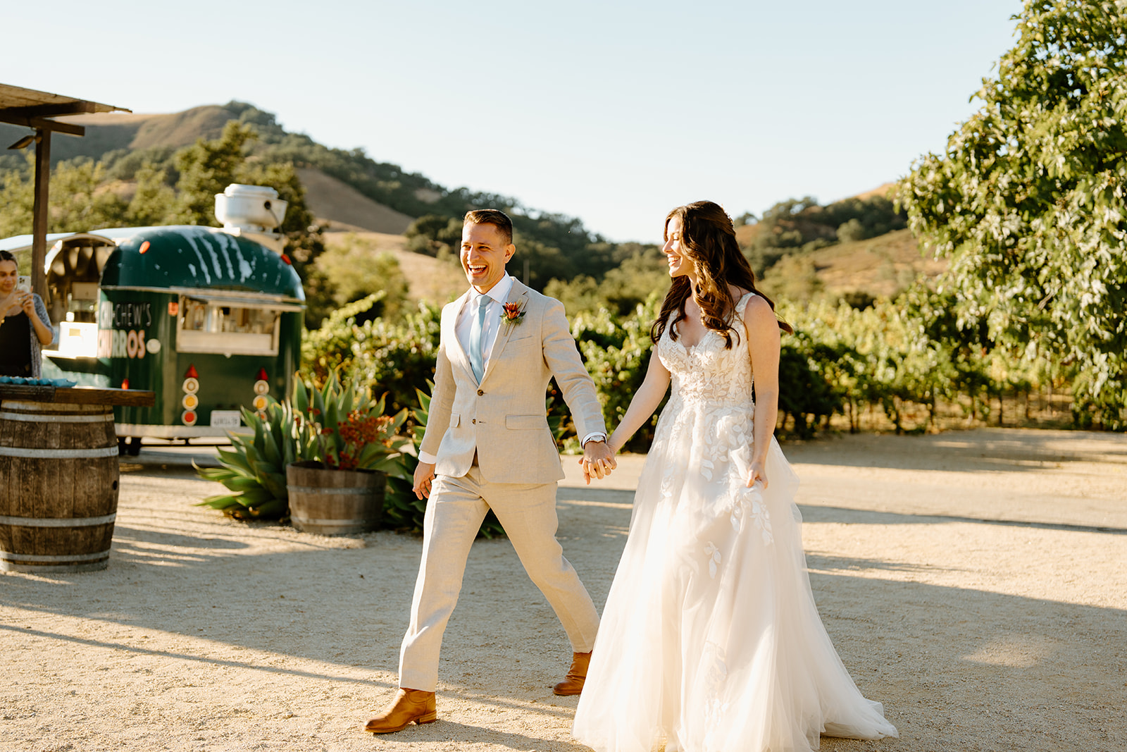 bride and groom walk together at Higuera Ranch, San Luis Obispo CA, photography by Cobblestone