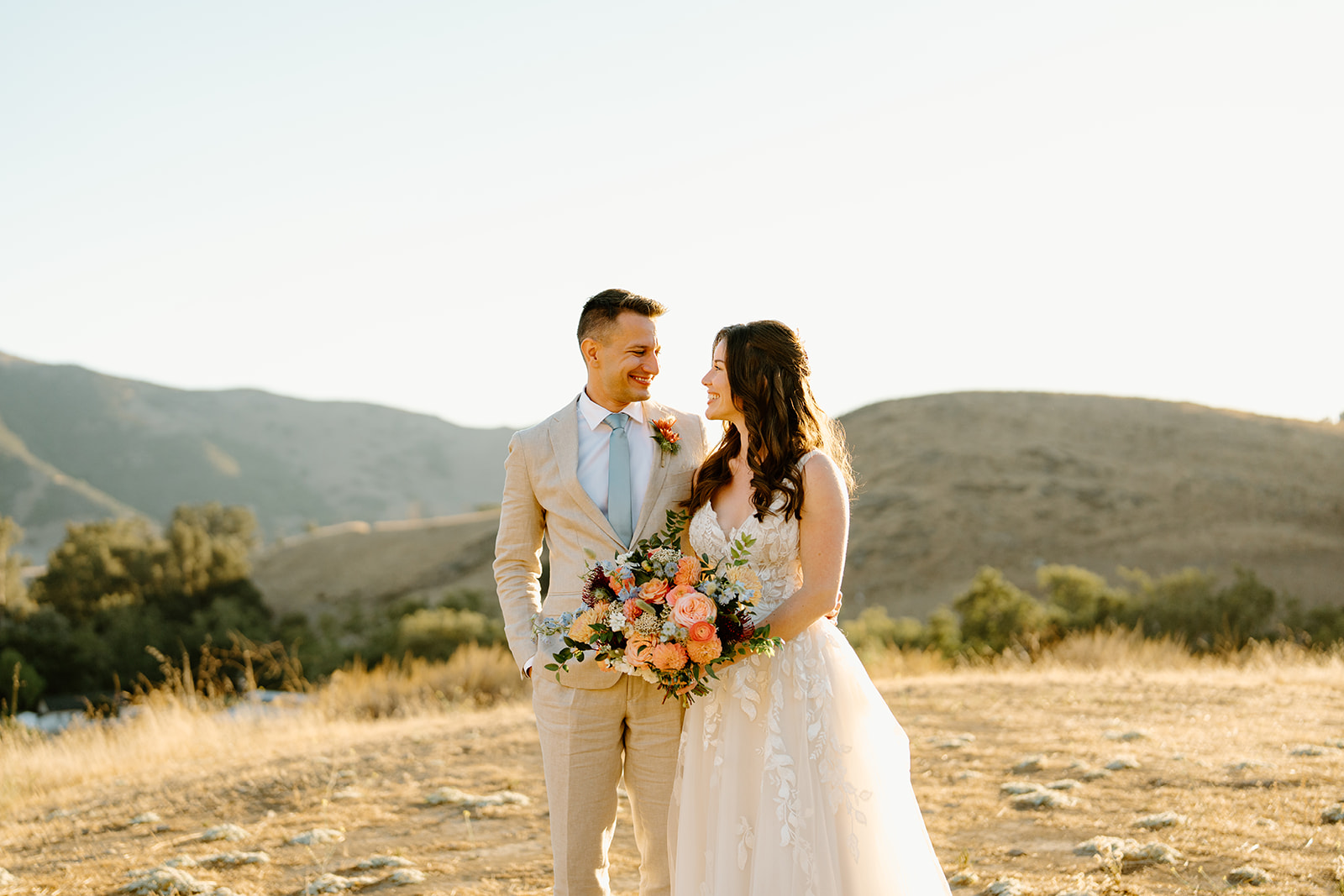 bride and groom pose at Higuera Ranch, San Luis Obispo CA, photography by Cobblestone
